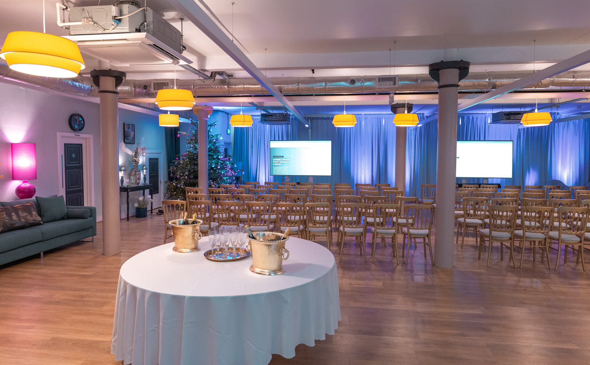 Event space at Lumiere Underwood with chairs and soft lighting for corporate meetings.