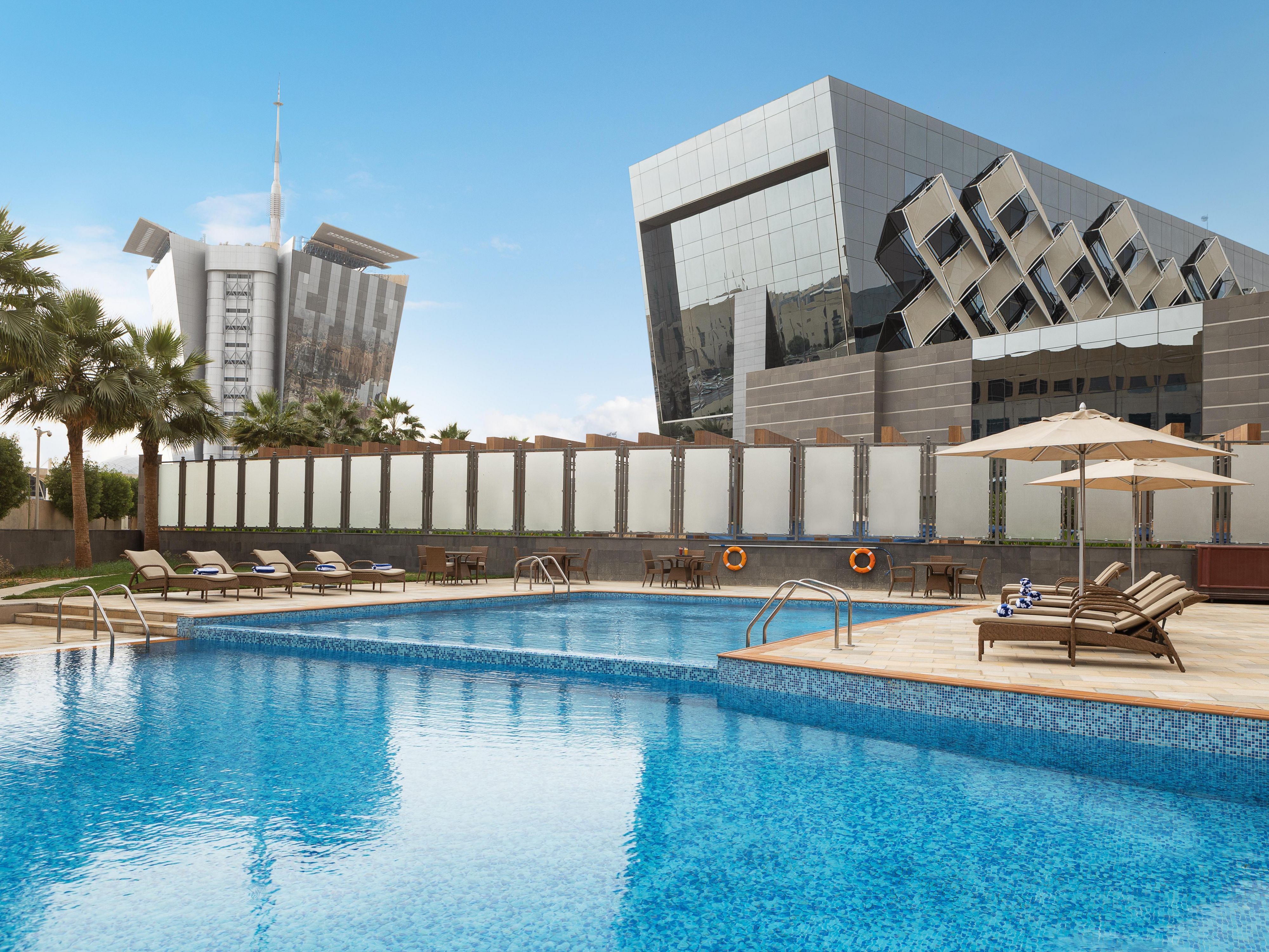 Ibn Batouta at Crowne Plaza Riyadh RDC, sleek venue with outdoor pool for events.