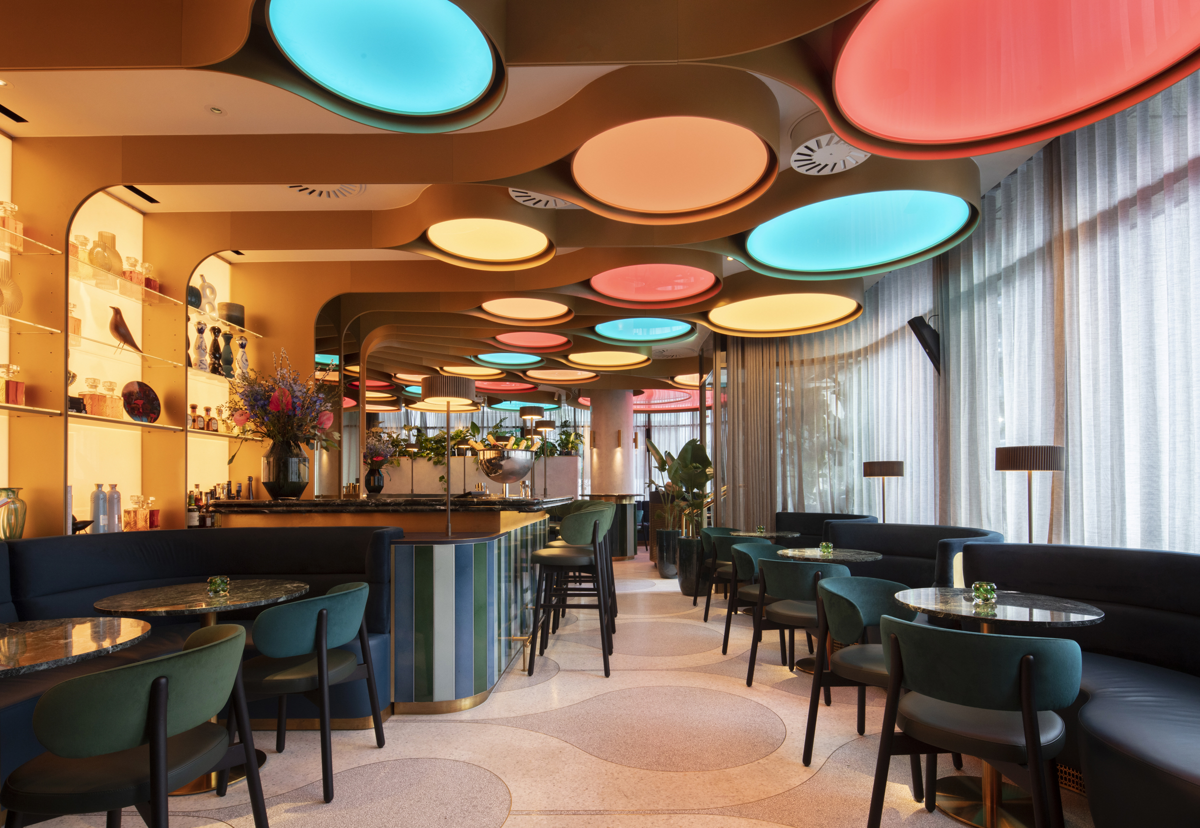 Modern BoTree Bar with vibrant ceiling, ideal for meetings and events.