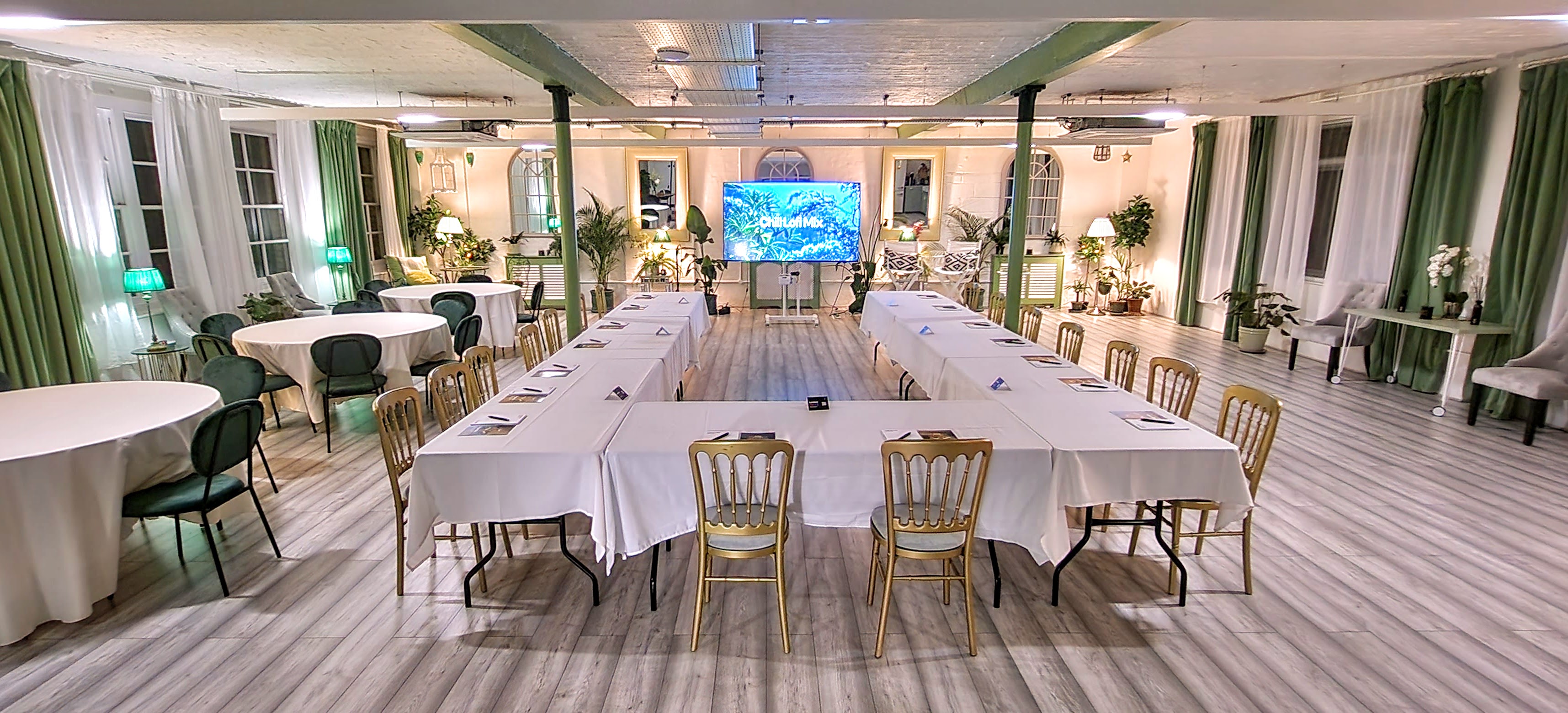 The Palm Room meeting space with U-shaped tables for workshops and presentations.