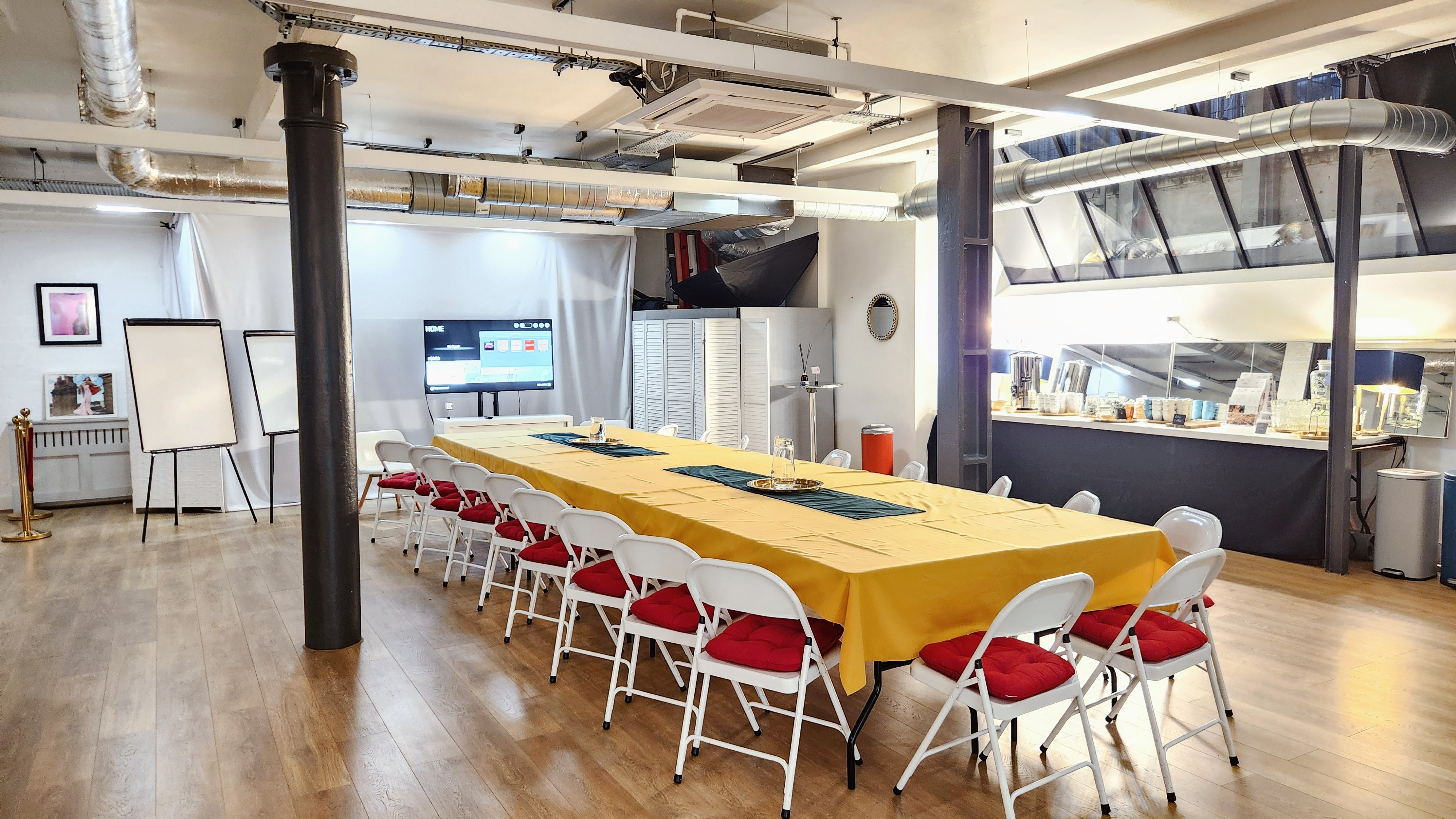 Meeting space in The Palm Room with projector, ideal for workshops and team collaboration.