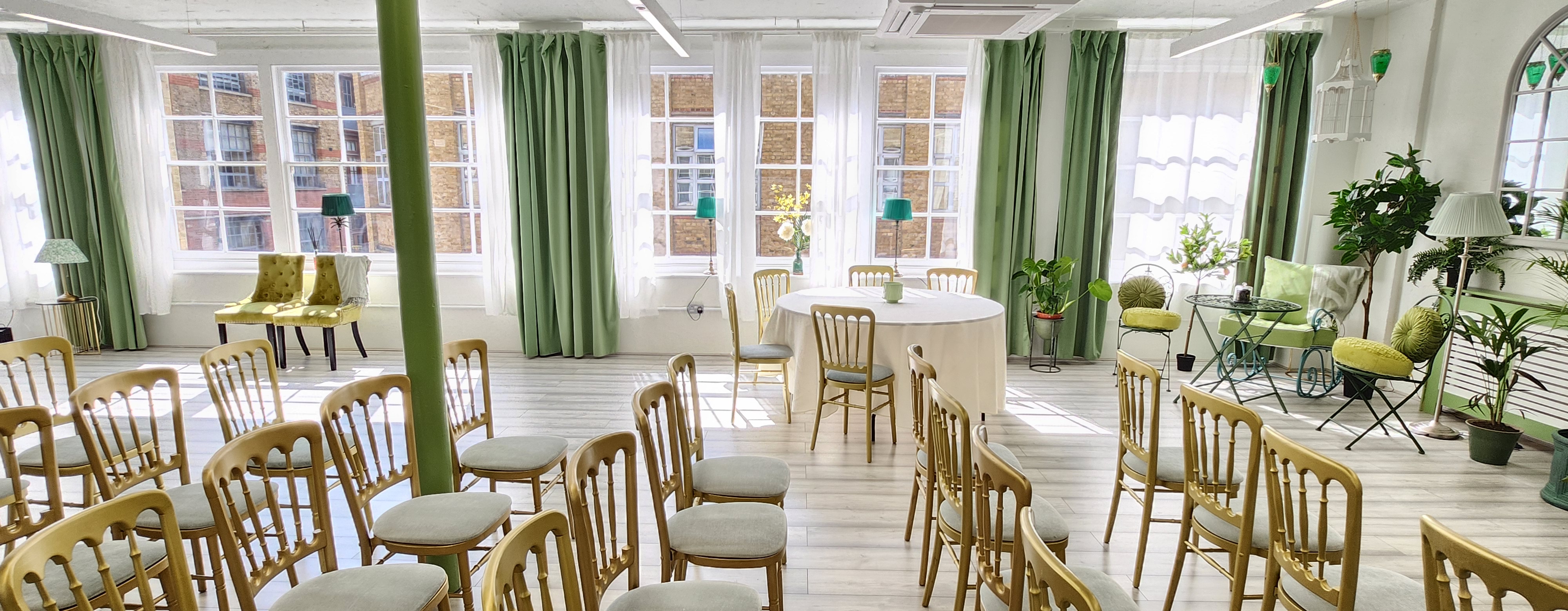 Bright meeting space with large windows, ideal for workshops and gatherings.