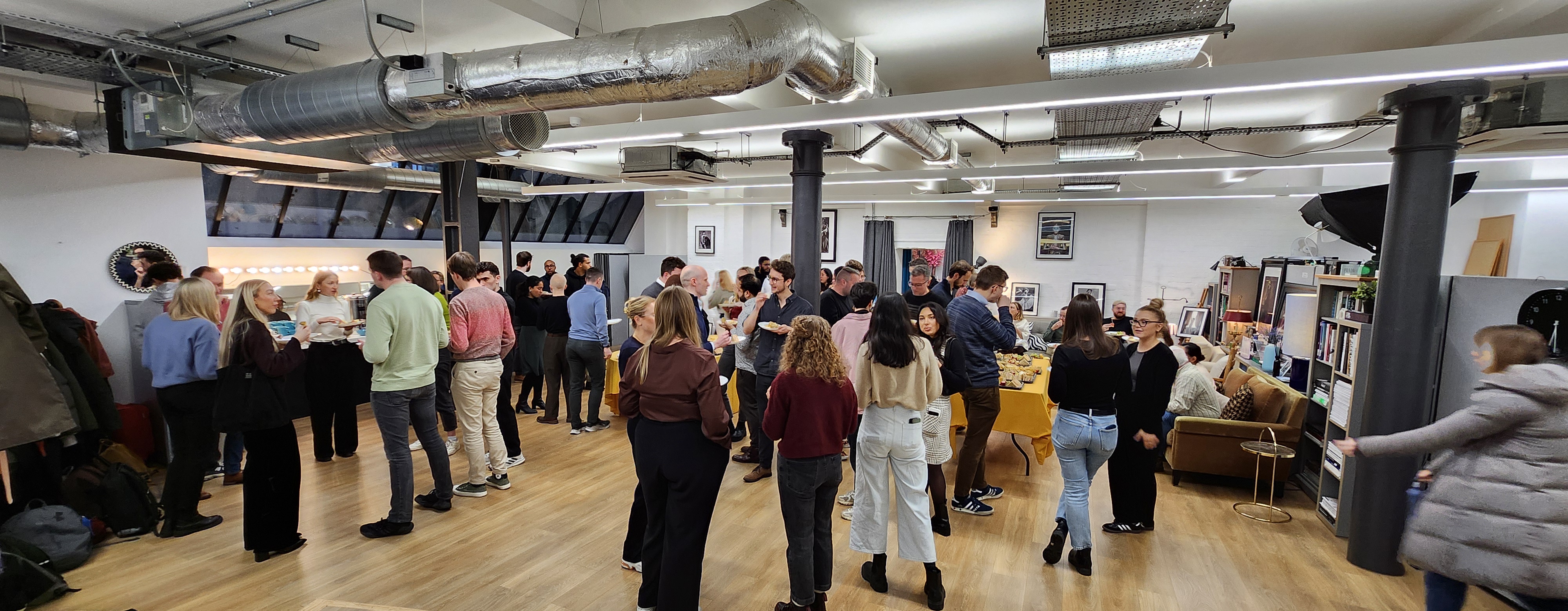 Networking event in The Palm Room featuring modern decor and lively interactions.