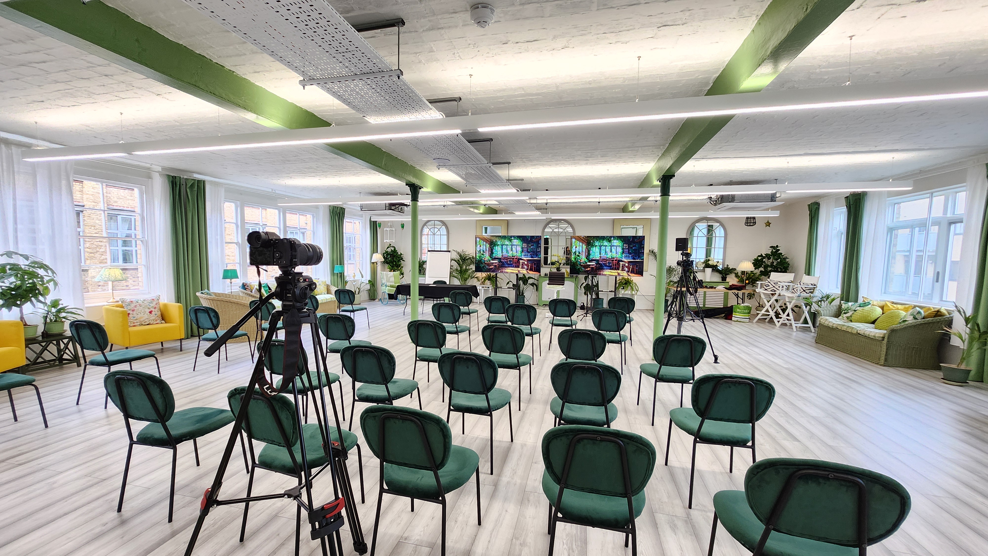 Modern event space in The Palm Room, perfect for presentations and panel discussions.