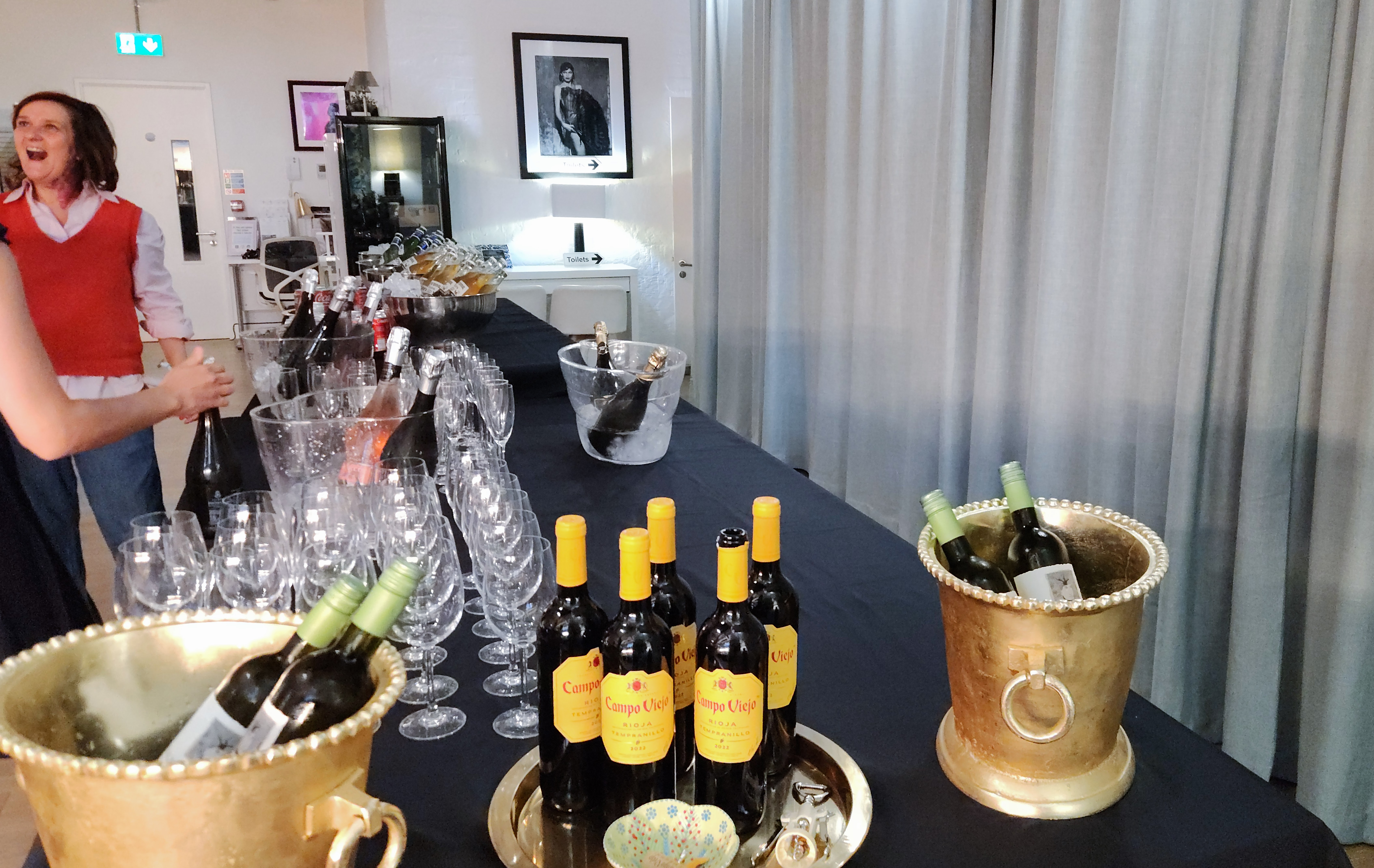 Elegant event setup in The Palm Room with a sleek bar and vibrant atmosphere.