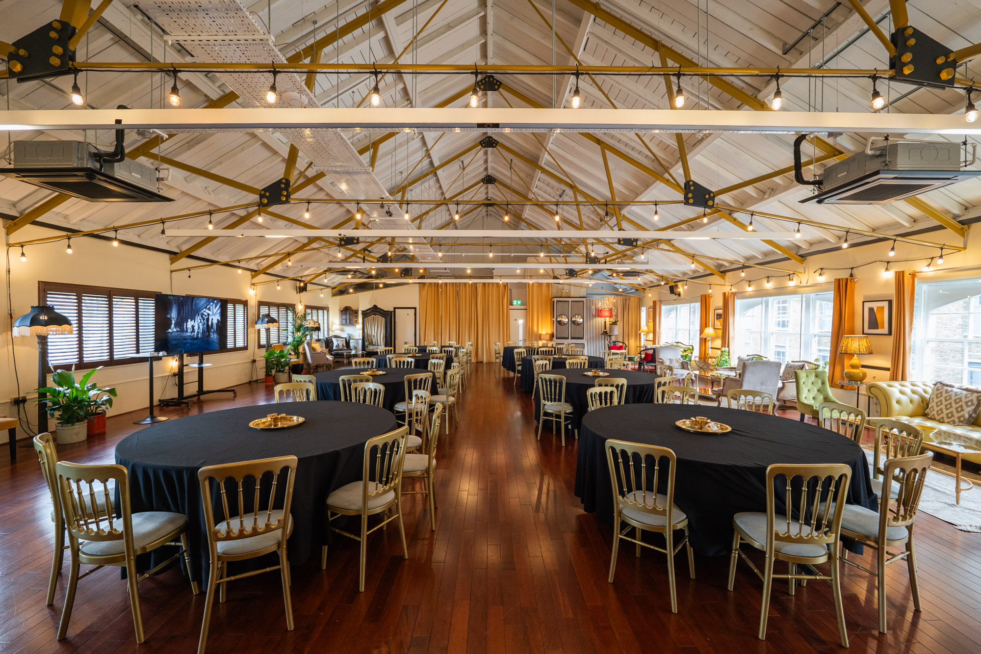New Victorian Loft: Elegant event space with round tables for corporate meetings and social events.