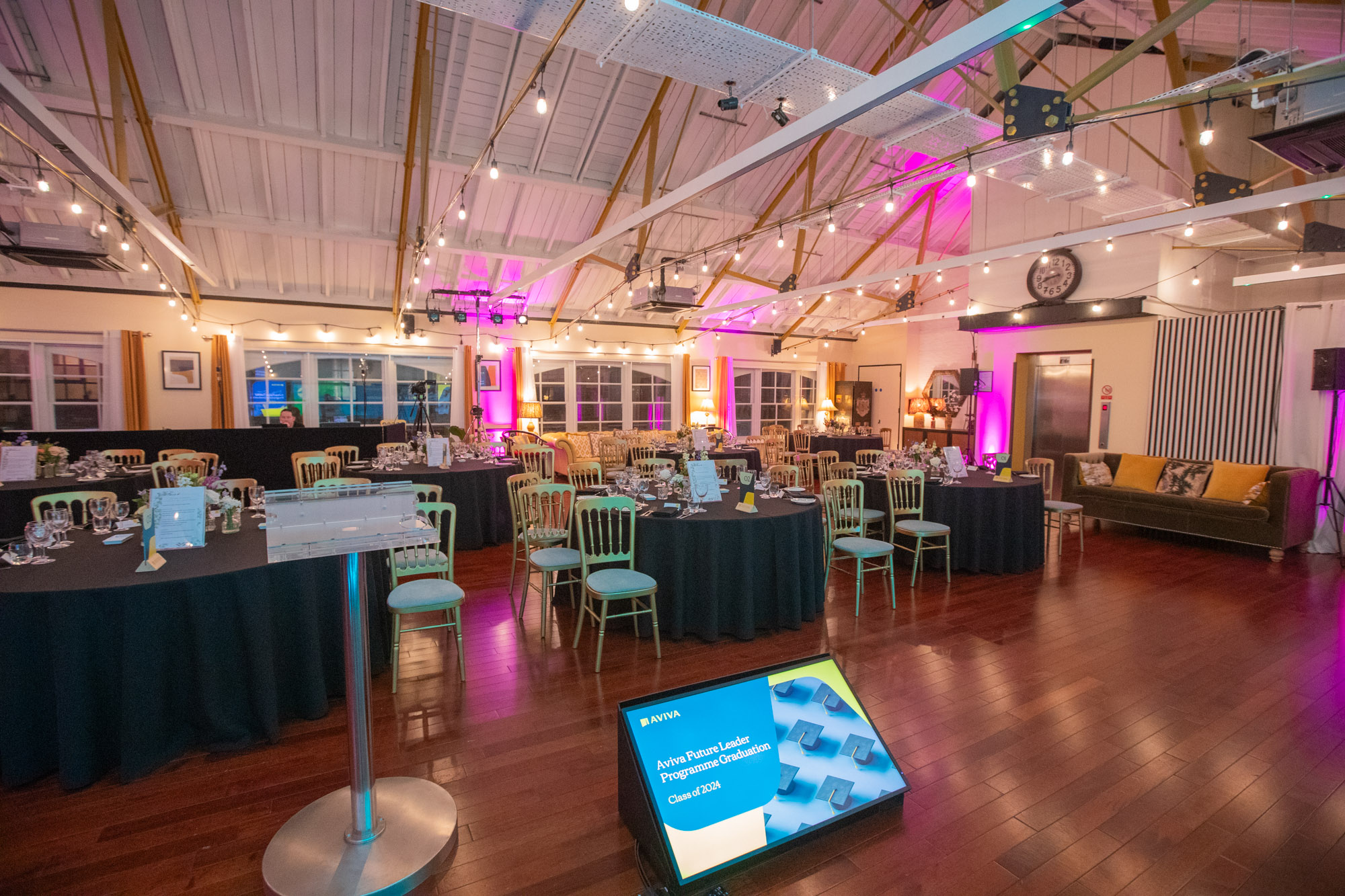 Elegant event space at New Victorian Loft with warm lighting, ideal for corporate gatherings.