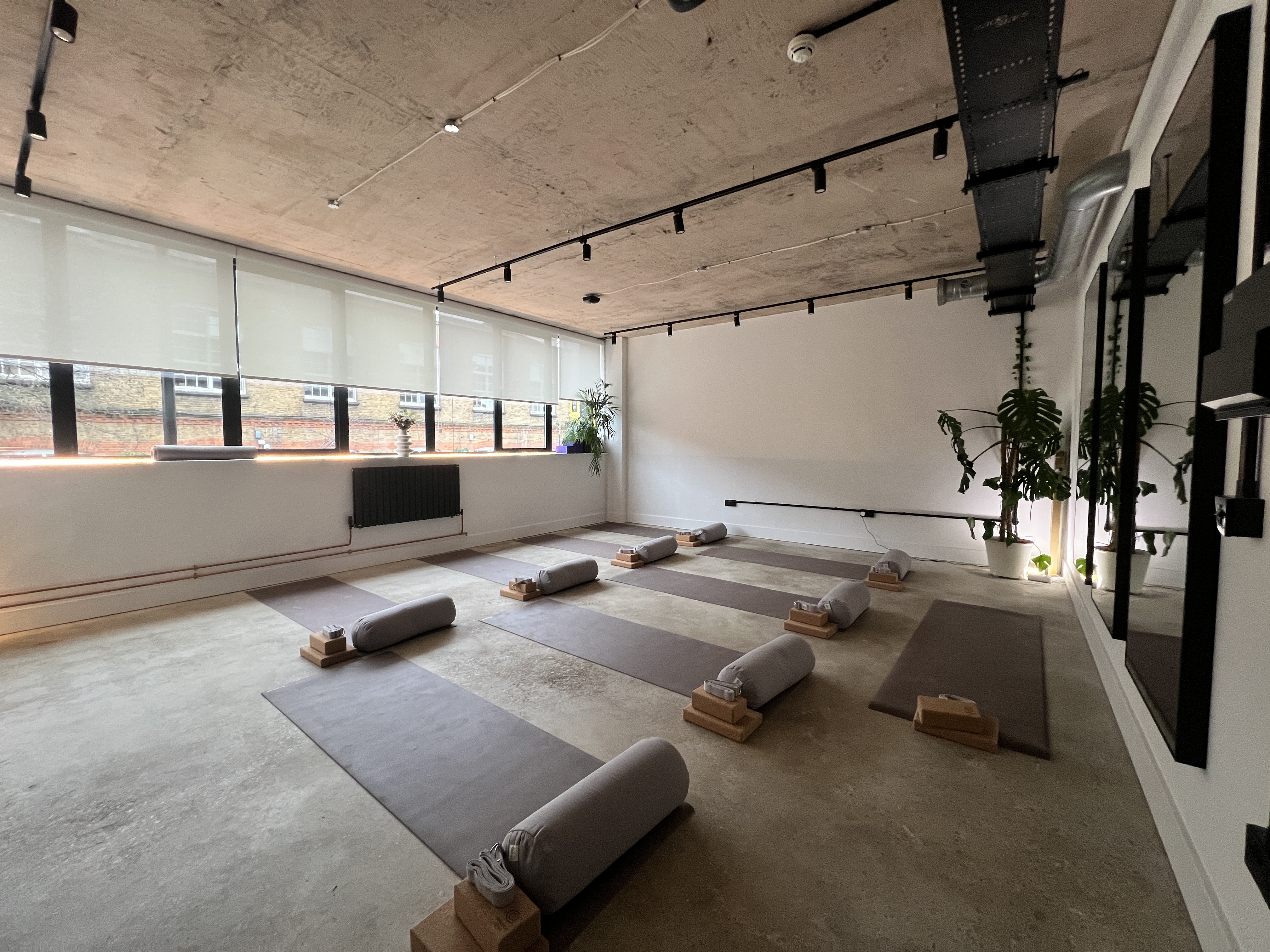 Bulba Studio industrial-chic space set for wellness breakout session or corporate yoga retreat.
