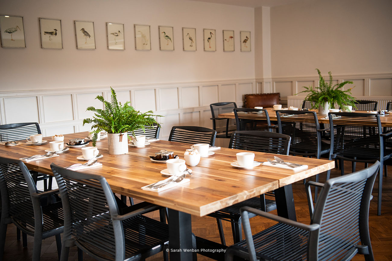 The Breakfast Room at Brookfield Barn: stylish wooden table for corporate meetings.