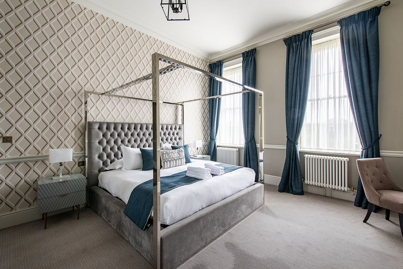 Luxurious four-poster bed in The Ballroom, Old Palace Chester for elegant retreats and meetings.