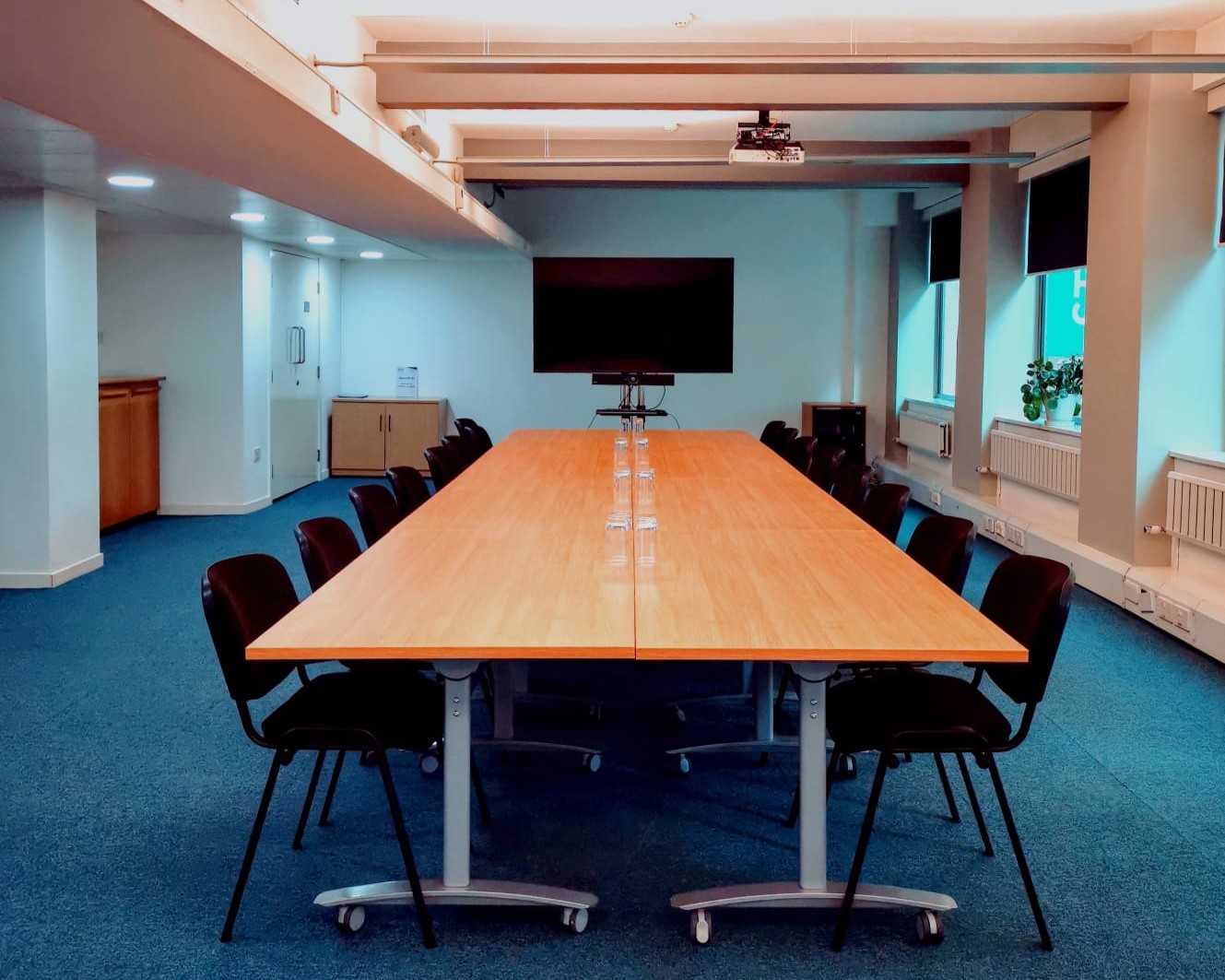 Spacious meeting room in Churchill House, ideal for corporate events and presentations.