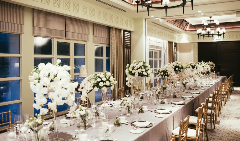 Elegant banquet table with floral arrangements at Banyan Deck, Shangri-La Singapore for weddings.