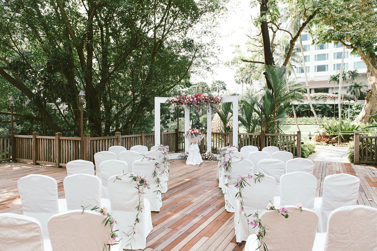 Banyan Deck wedding venue in Shangri-La Singapore with floral arch and elegant seating.