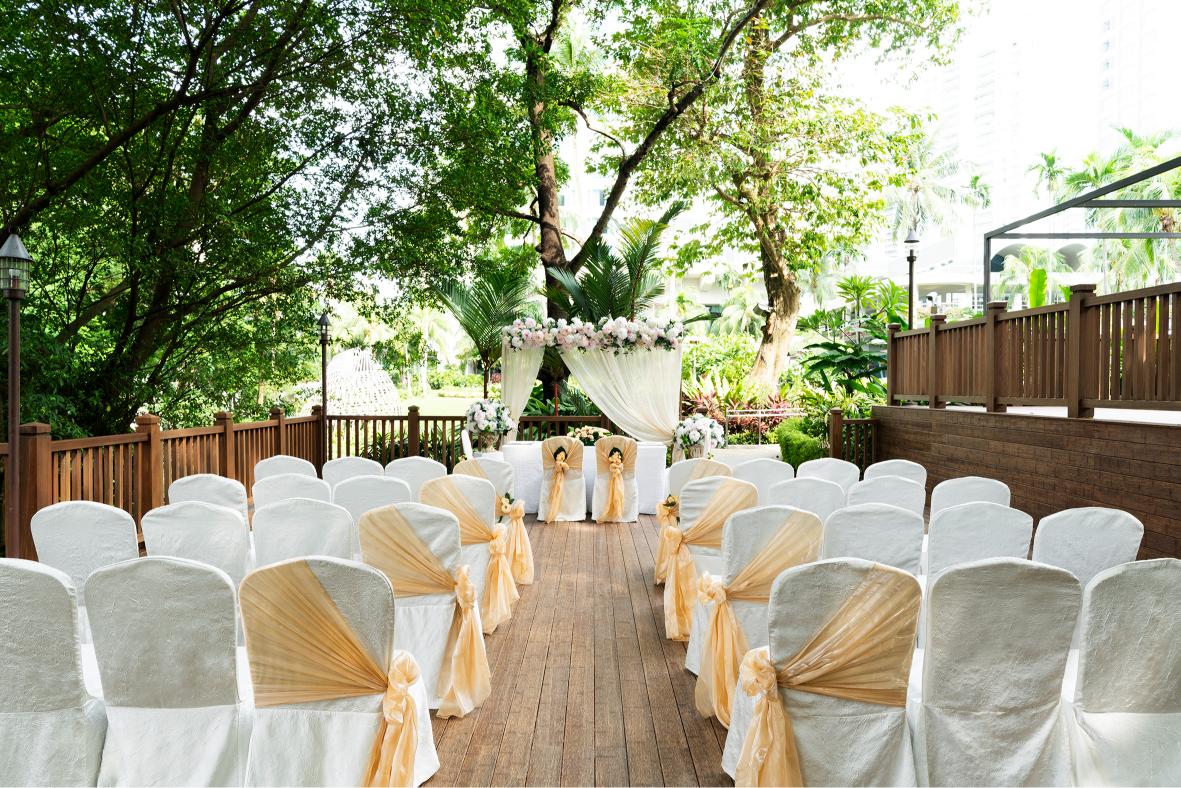Banyan Deck at Shangri-La Singapore, elegant outdoor wedding venue with floral backdrop.