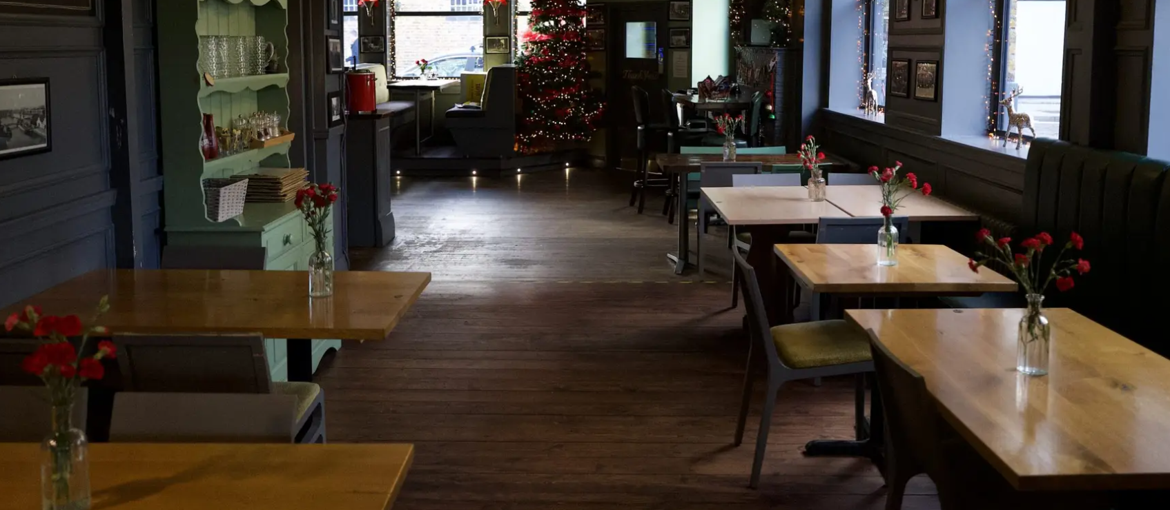 Cozy Dockers Inn pub with modular tables, perfect for festive holiday party and small event dining.