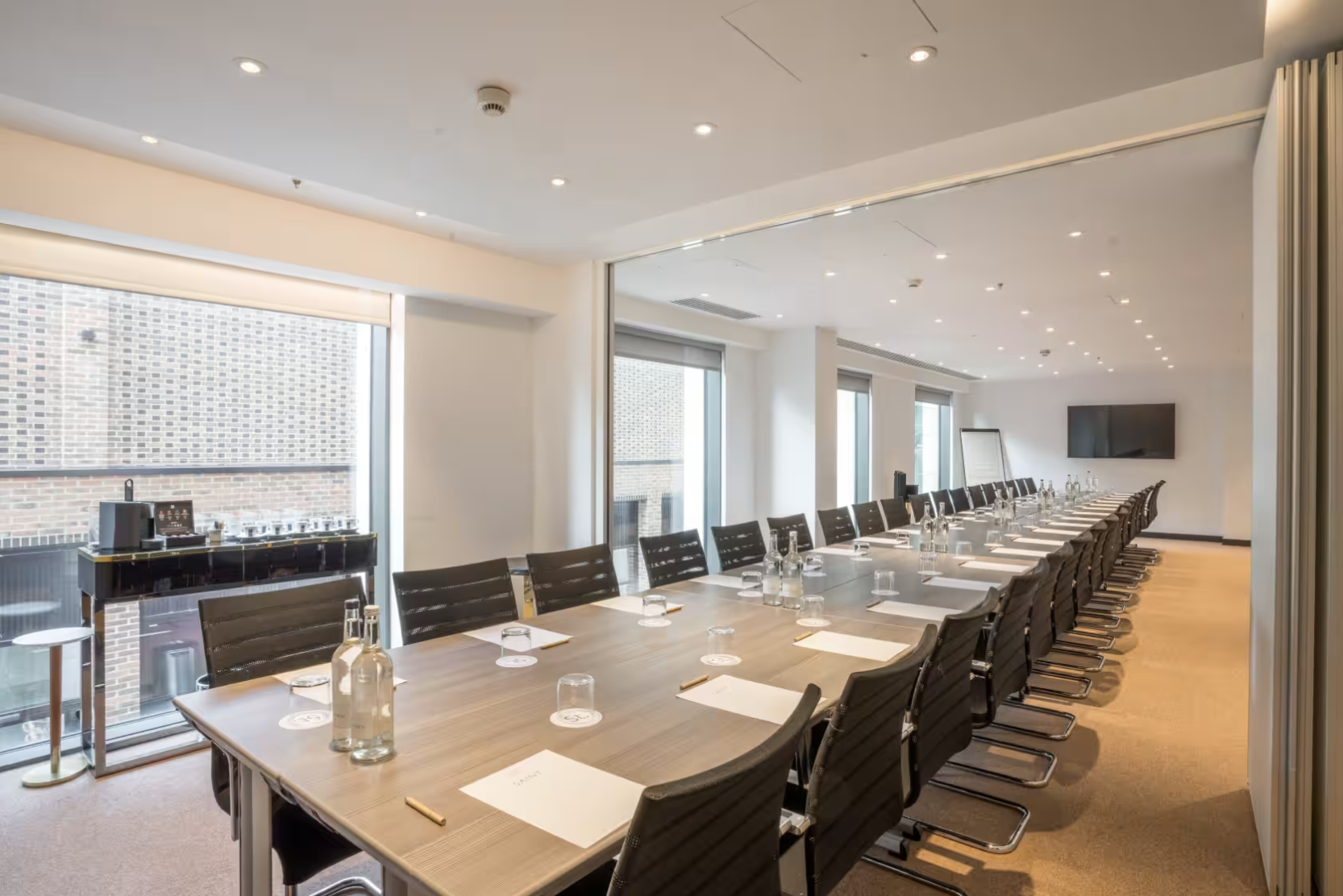 Aldgate Suite, modern conference room with natural light, ideal for business meetings.