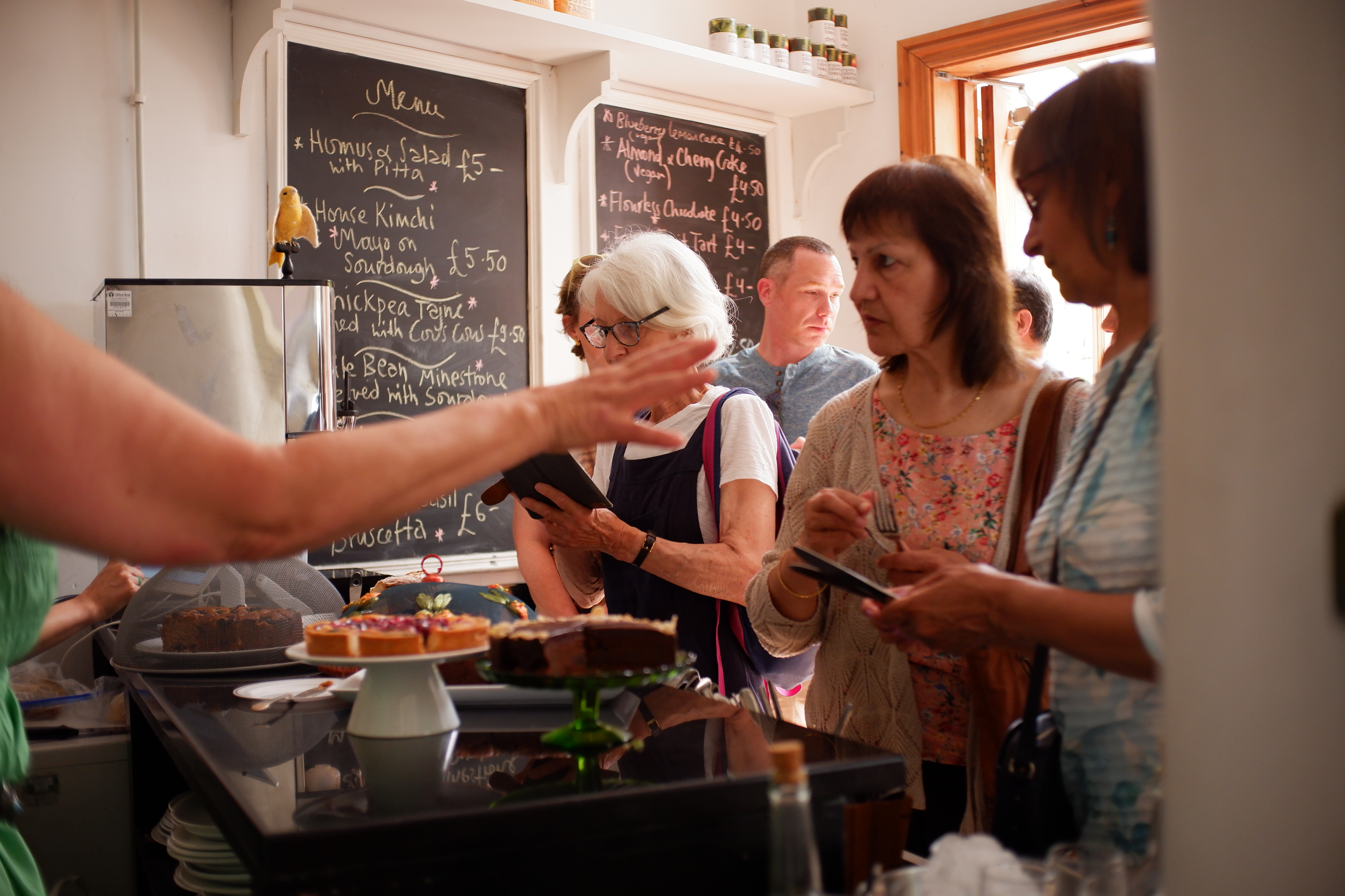 Jamyang Buddhist Centre cafe, vibrant gathering with refreshments for workshops and meetings.