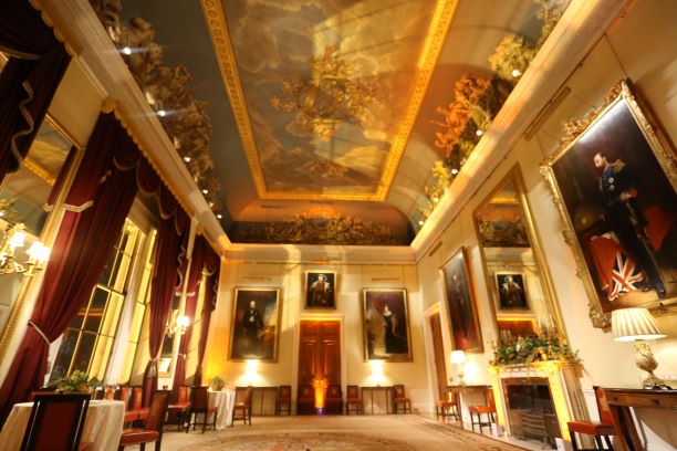 Elegant event space with high ceilings and chandelier for upscale meetings and gatherings.