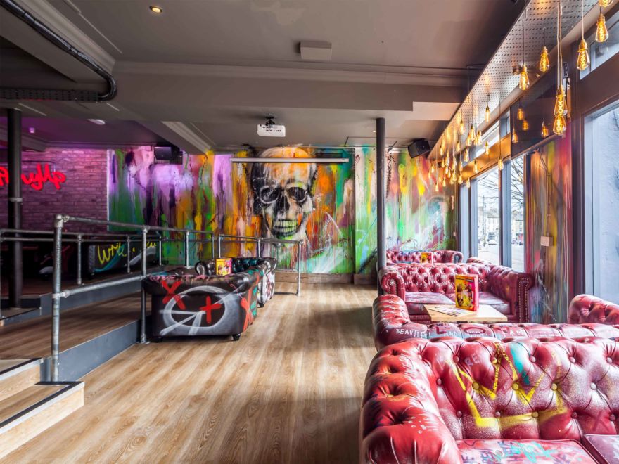 Vibrant graffiti lounge at Bar & Beyond Norwich, ideal for creative networking and event hire.
