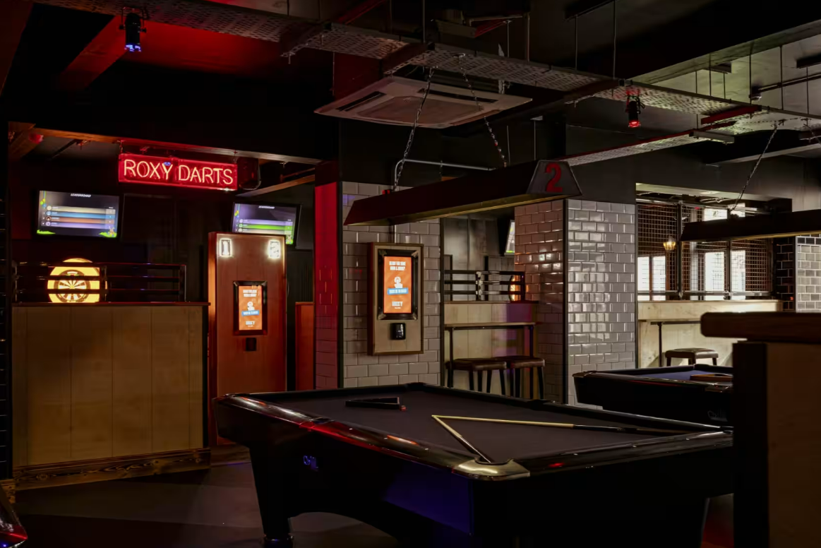 Vibrant Roxy Ball Room venue with games for after-work socials and team-building events.