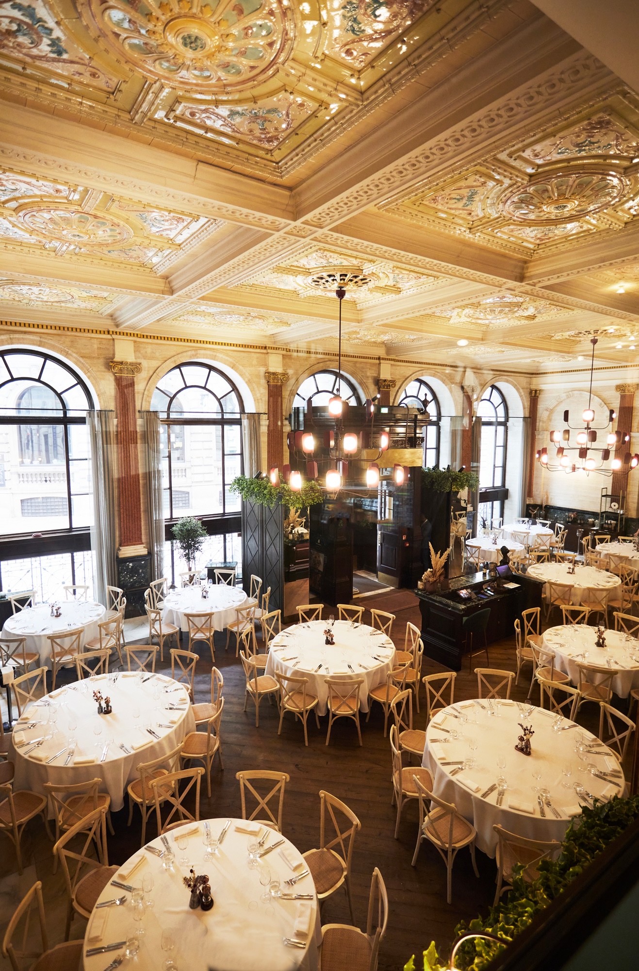 Elegant event space with round tables, ideal for weddings and corporate meetings.