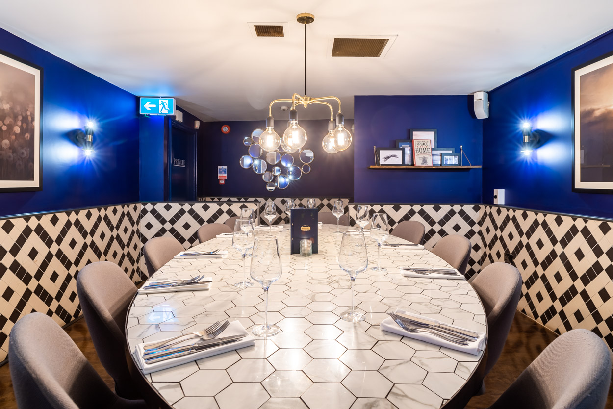 Private dining room at Browns Old Jewry with navy walls for VIP dinners and board meetings.