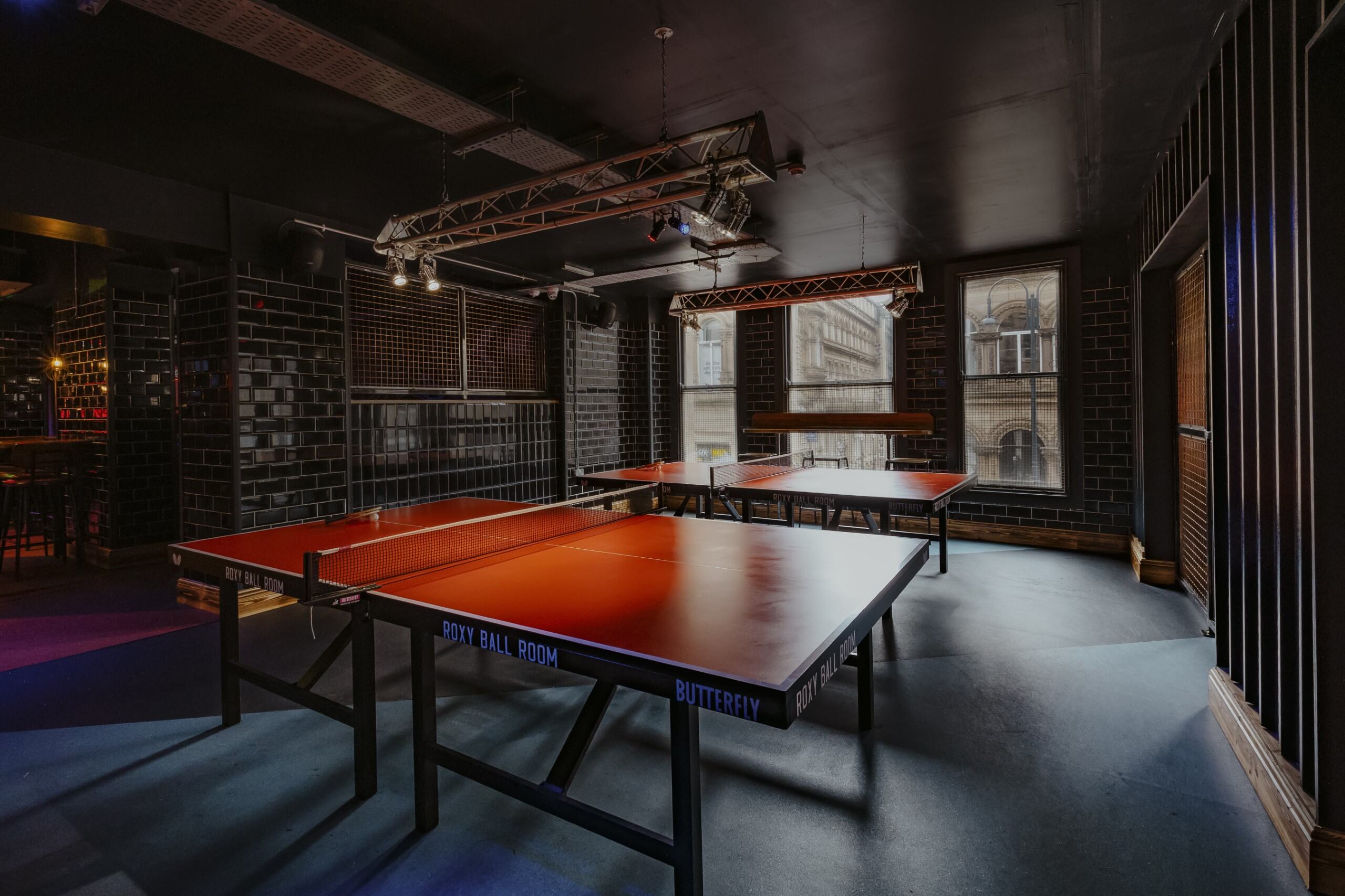 Versatile event space with ping pong tables for team building and networking at Roxy Ball Room.