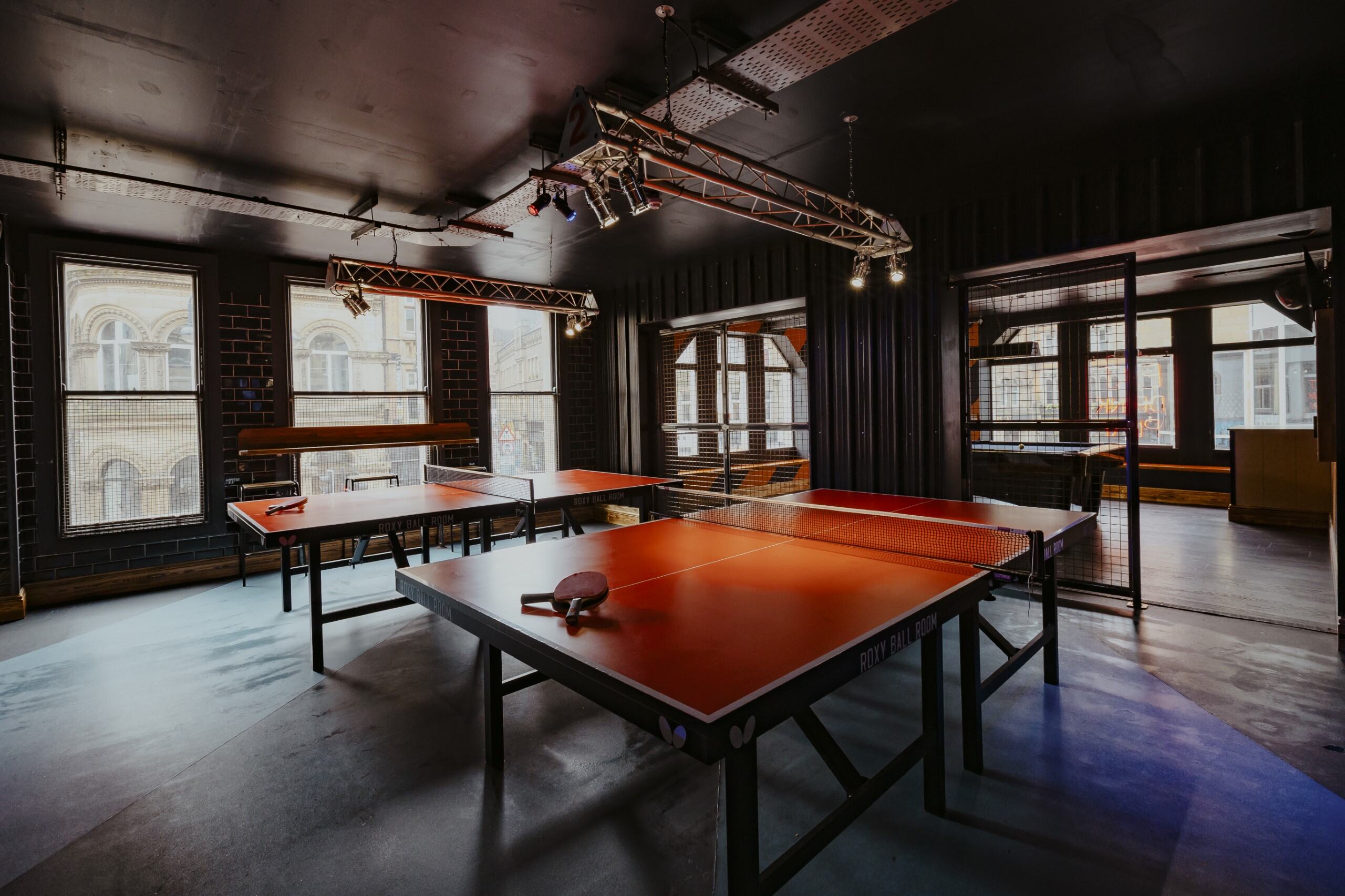 Modern event space at Roxy Ball Room, Boar Lane, with ping pong tables for team-building.