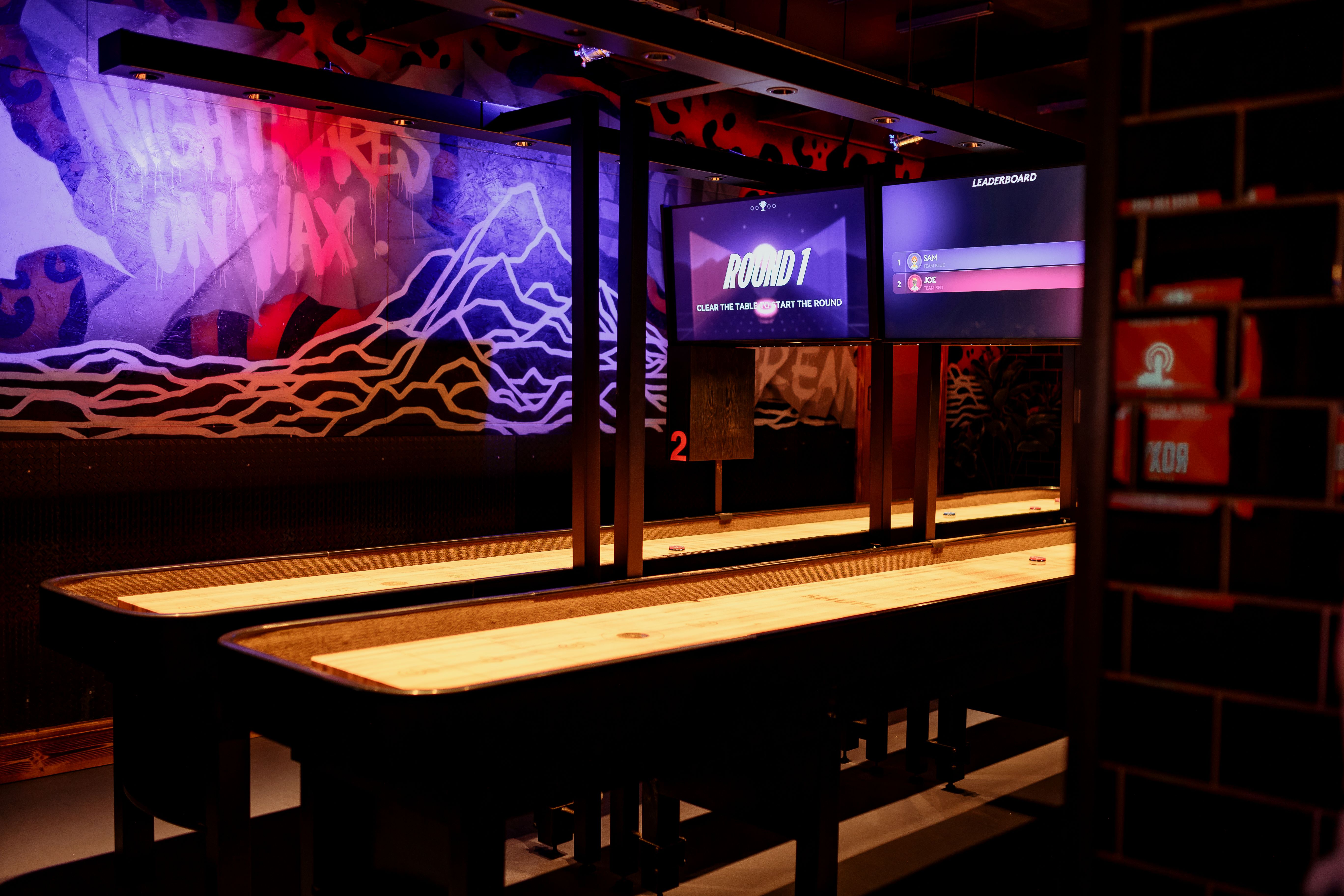 Vibrant shuffleboard event space at Roxy Ball Room for corporate gatherings and social events.