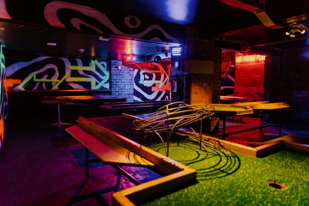 Vibrant Roxy Ball Room event space with neon decor for casual gatherings in Leeds.