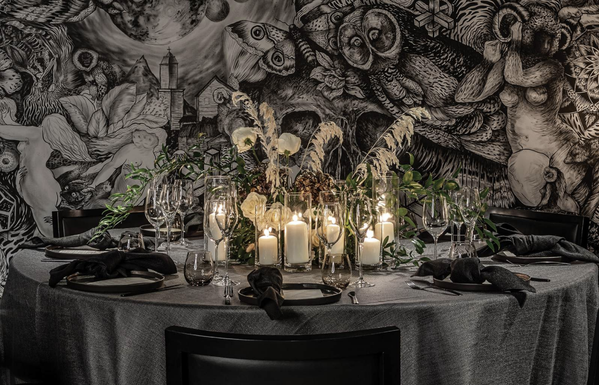 Elegant round table with candles at Masha Hari Theatre for upscale events.