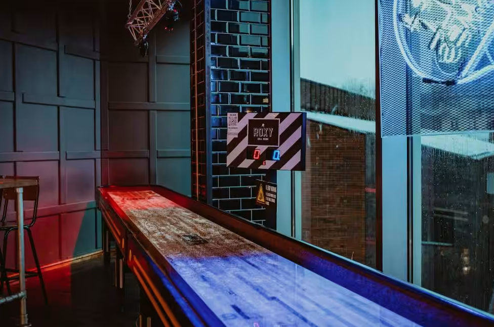 Vibrant game area at The Clubhouse, Roxy Ball Room, ideal for events and networking.