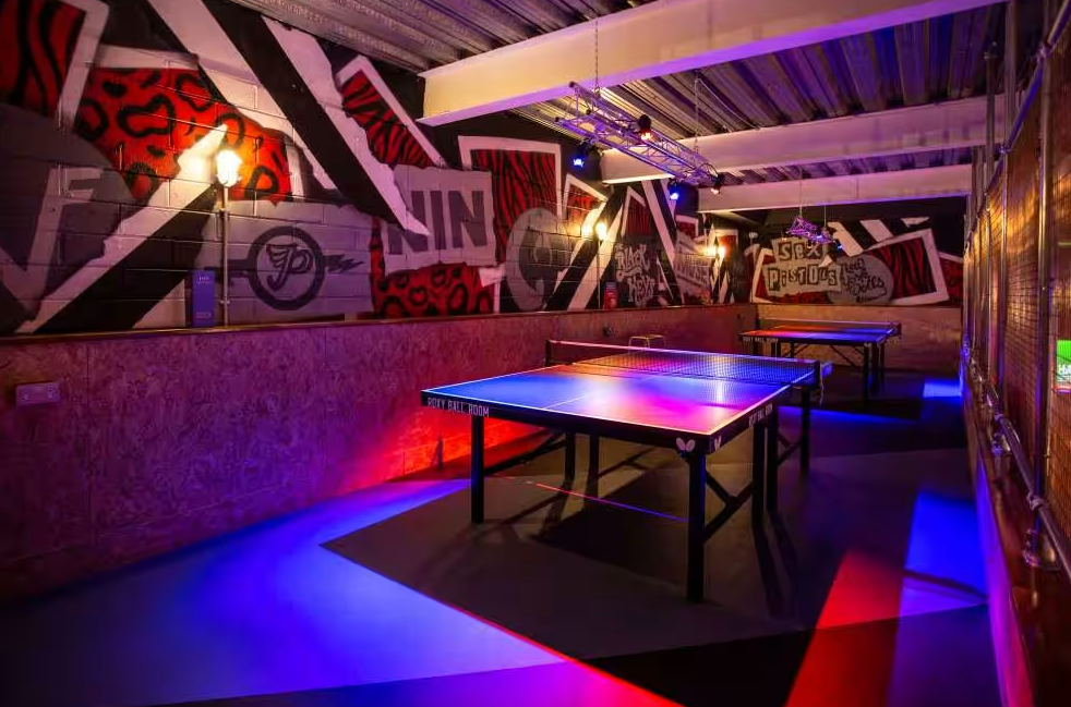Vibrant event space with ping pong tables at Roxy Ball Room, Liverpool for networking.