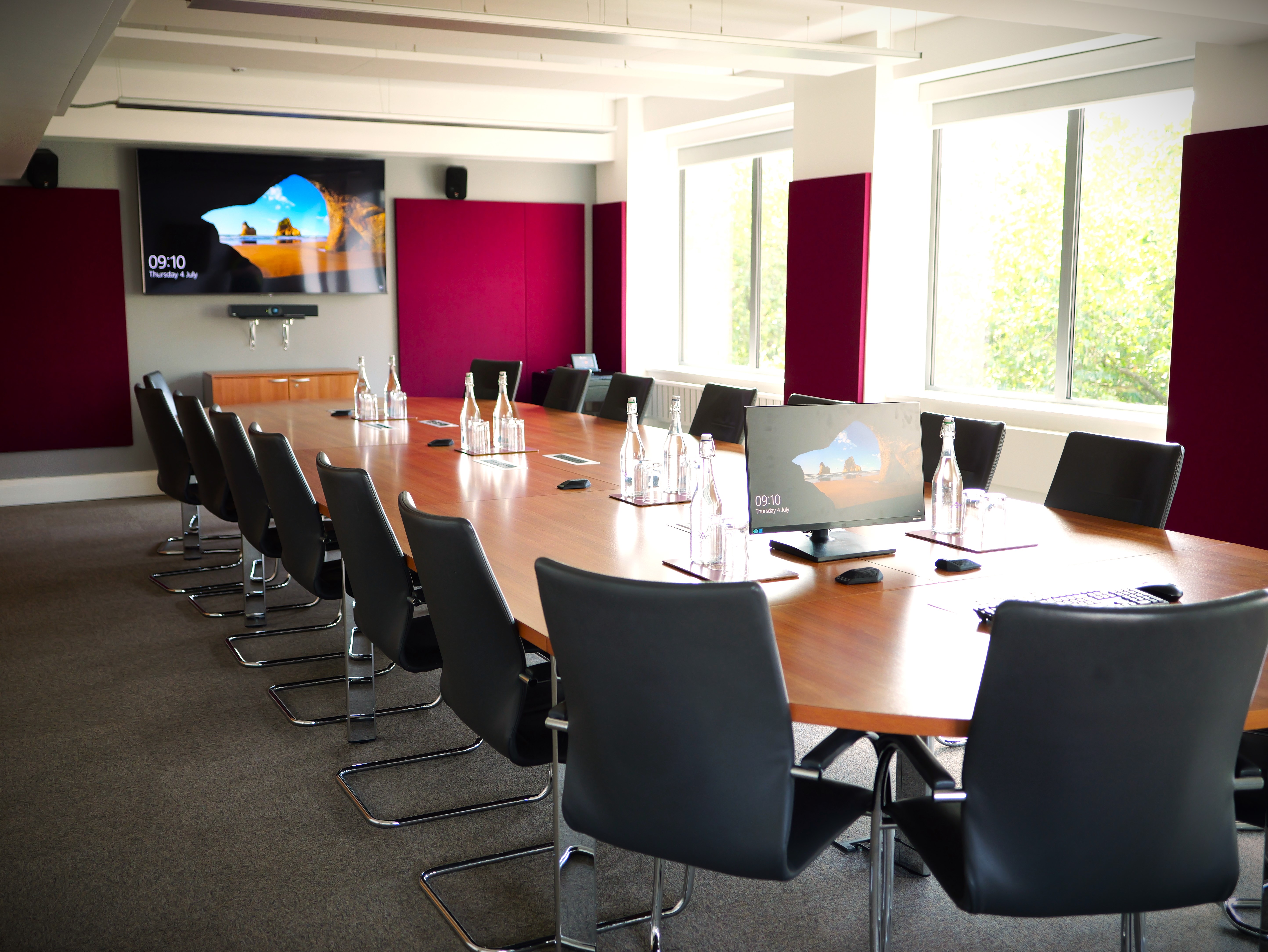 Modern meeting room with large table, ideal for corporate events at Churchill House.