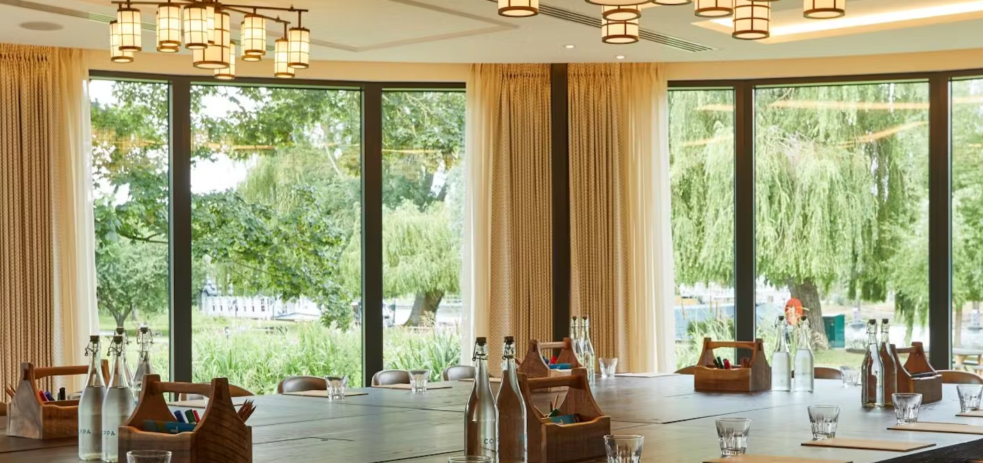 Board meeting at Wagtail Coppa Club: modern room with scenic views for corporate events.