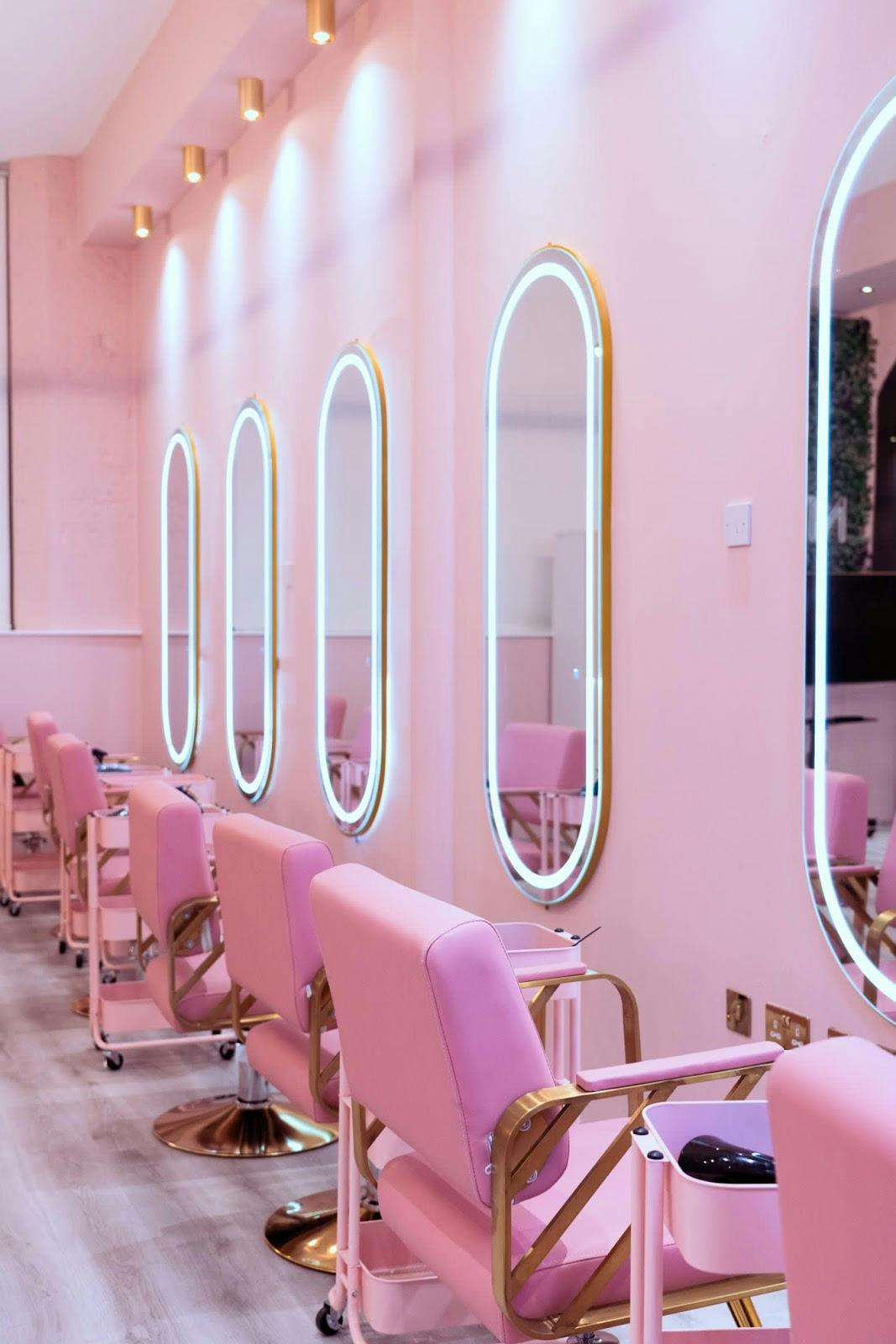 Monochromatic beauty salon with linear lighting for brand activations and experiential pop-ups.