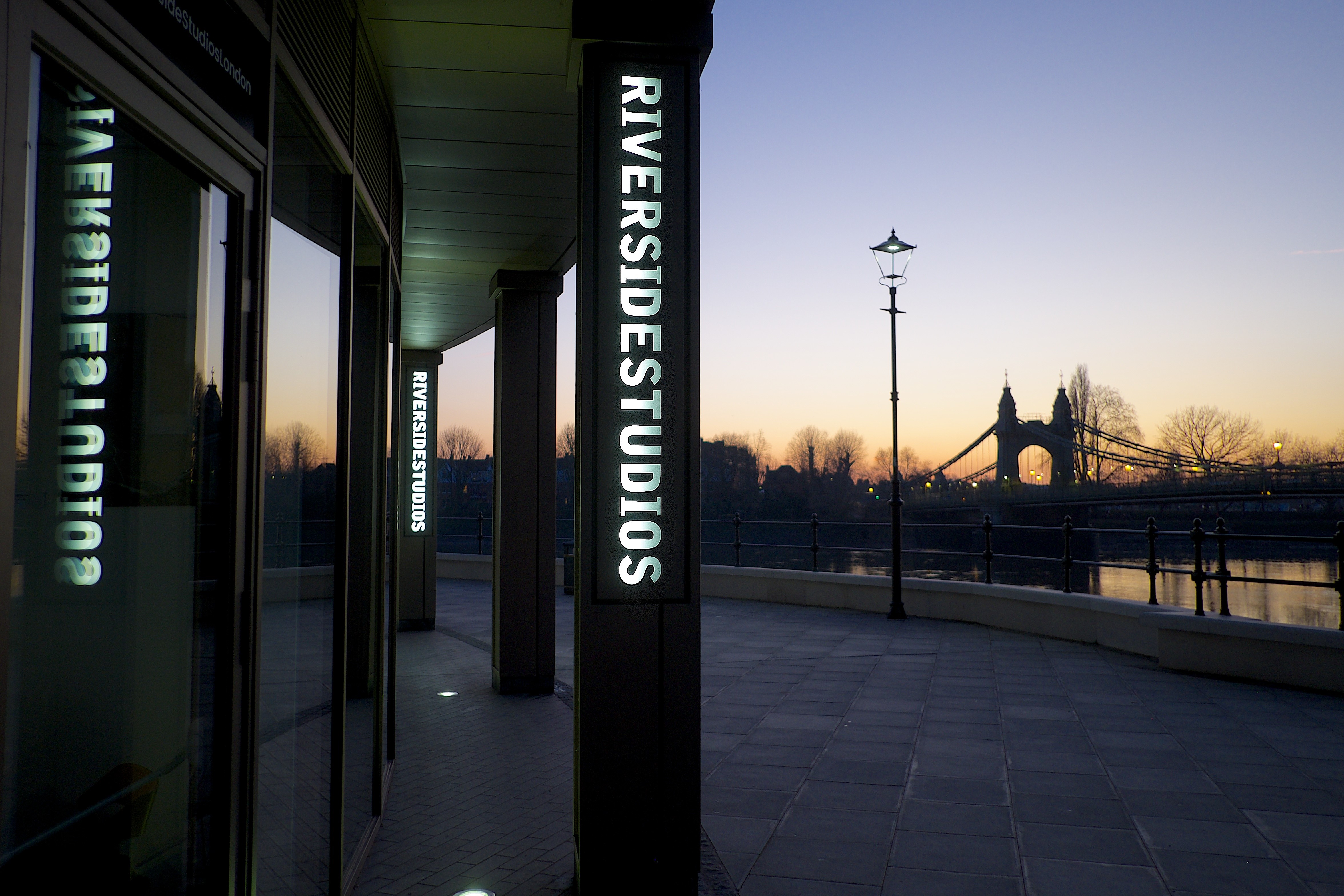 Riverside Studios Cinema Screen 1, modern venue for events by the river at twilight.