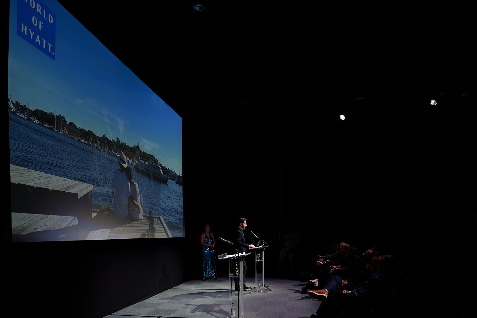"Riverside Studios Cinema Screen 1 with speaker, scenic backdrop for professional events."