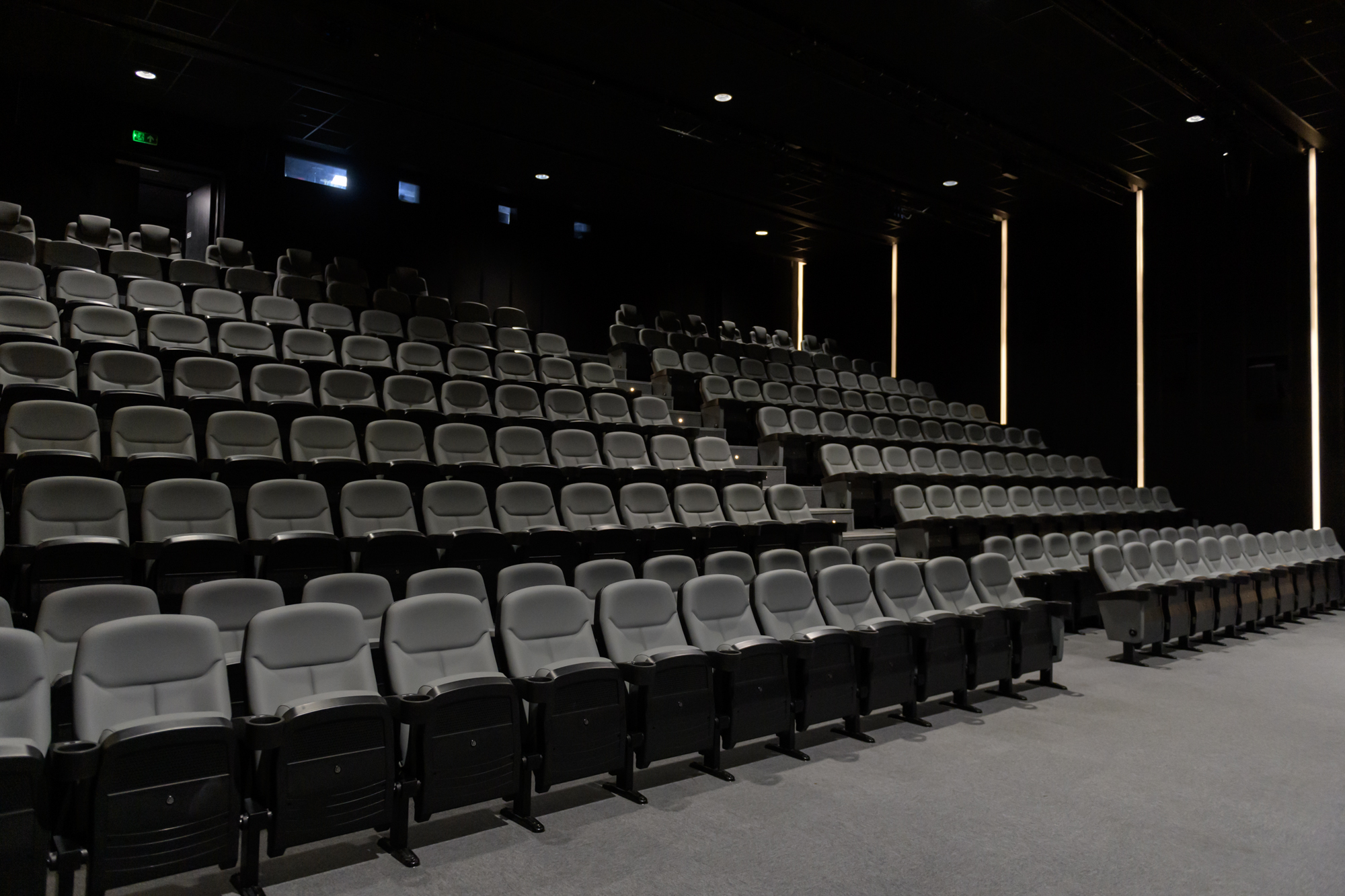 Modern auditorium with tiered seating at Riverside Studios for impactful presentations.