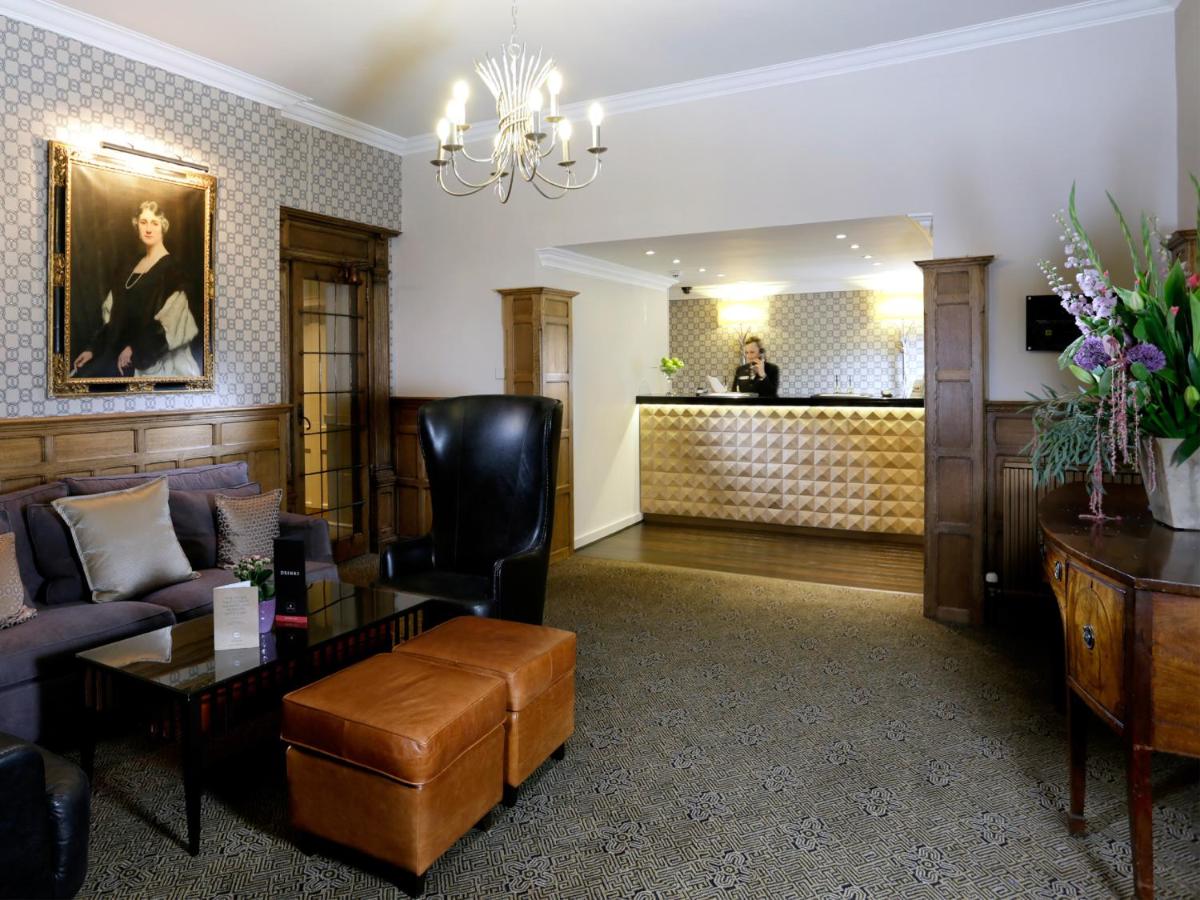 Windsor & Eton Suite: elegant hotel registration hub for boutique corporate retreats.