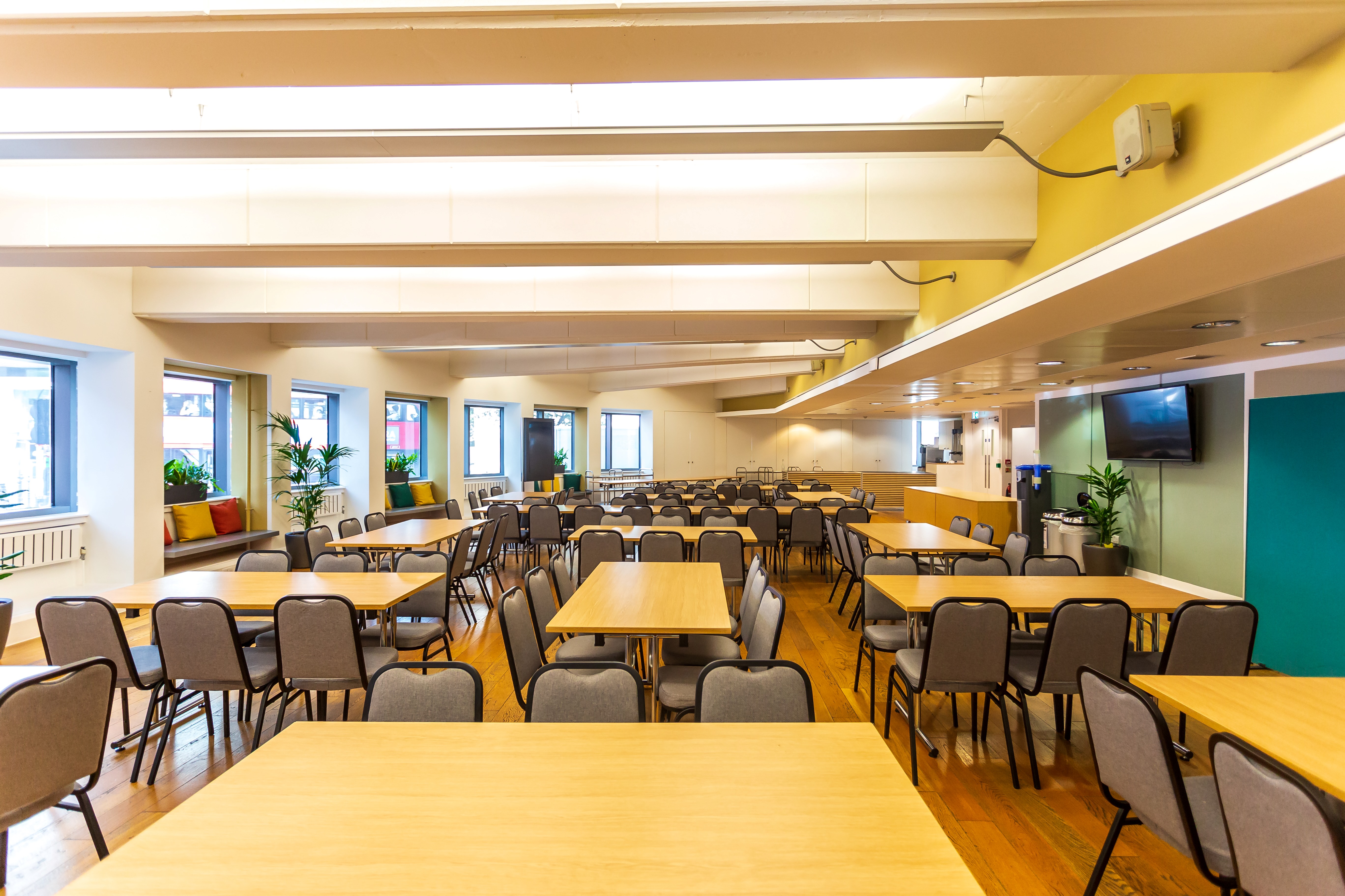 Spacious Café in Churchill House for conferences and workshops, featuring natural light.