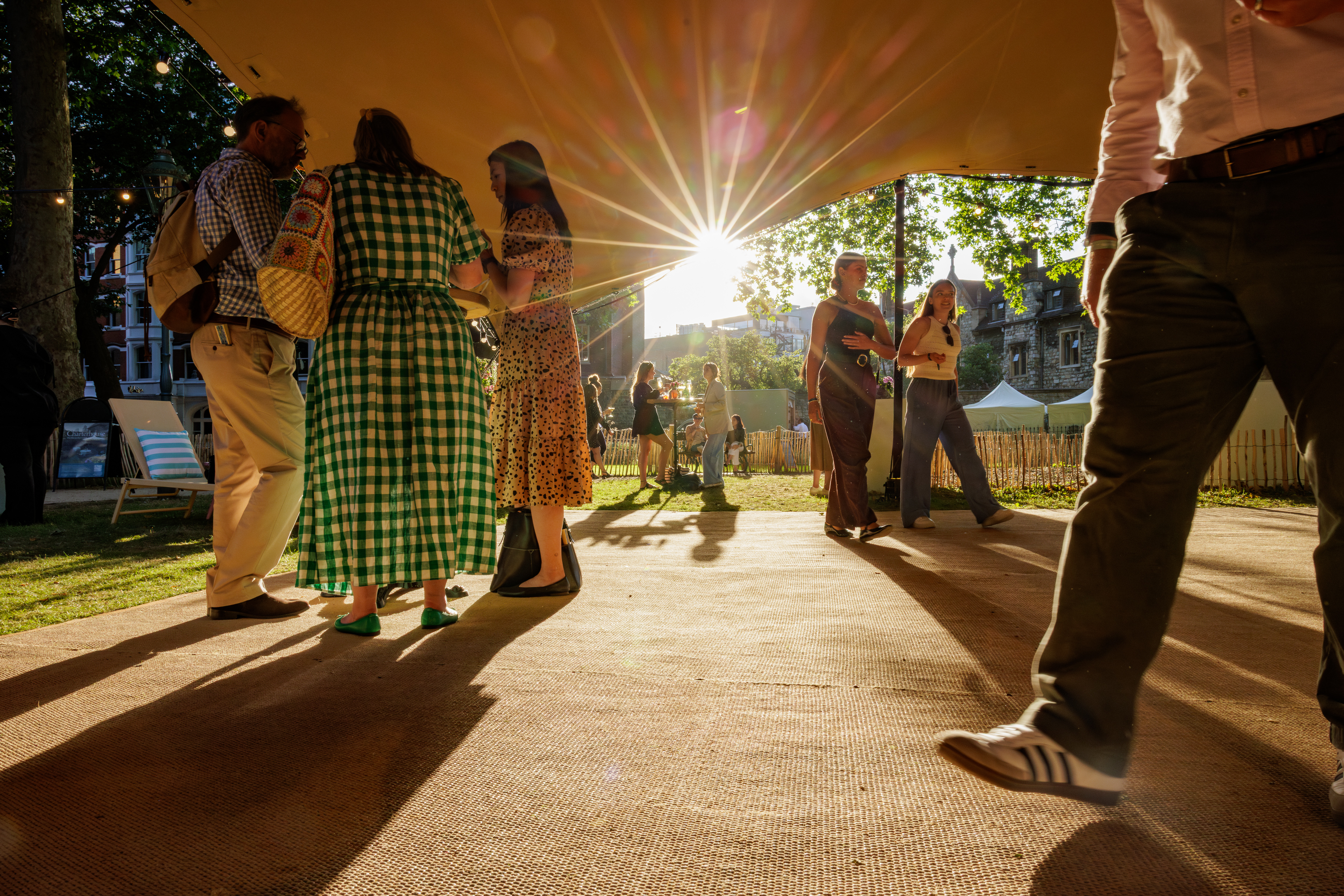 Outdoor summer party in Charterhouse Square with vibrant attendees networking.