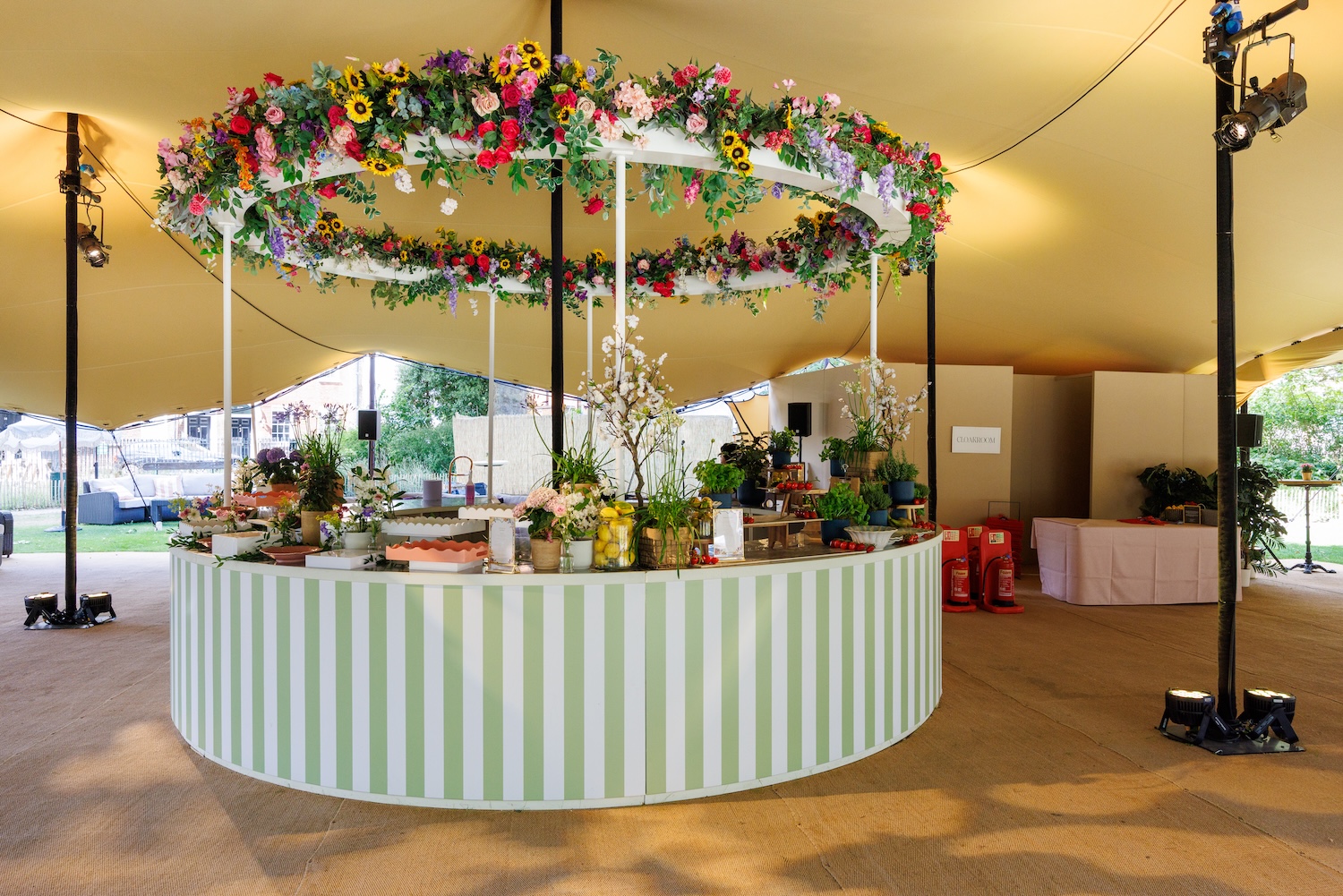 Elegant summer party setup with floral decor and buffet at Charterhouse Square.