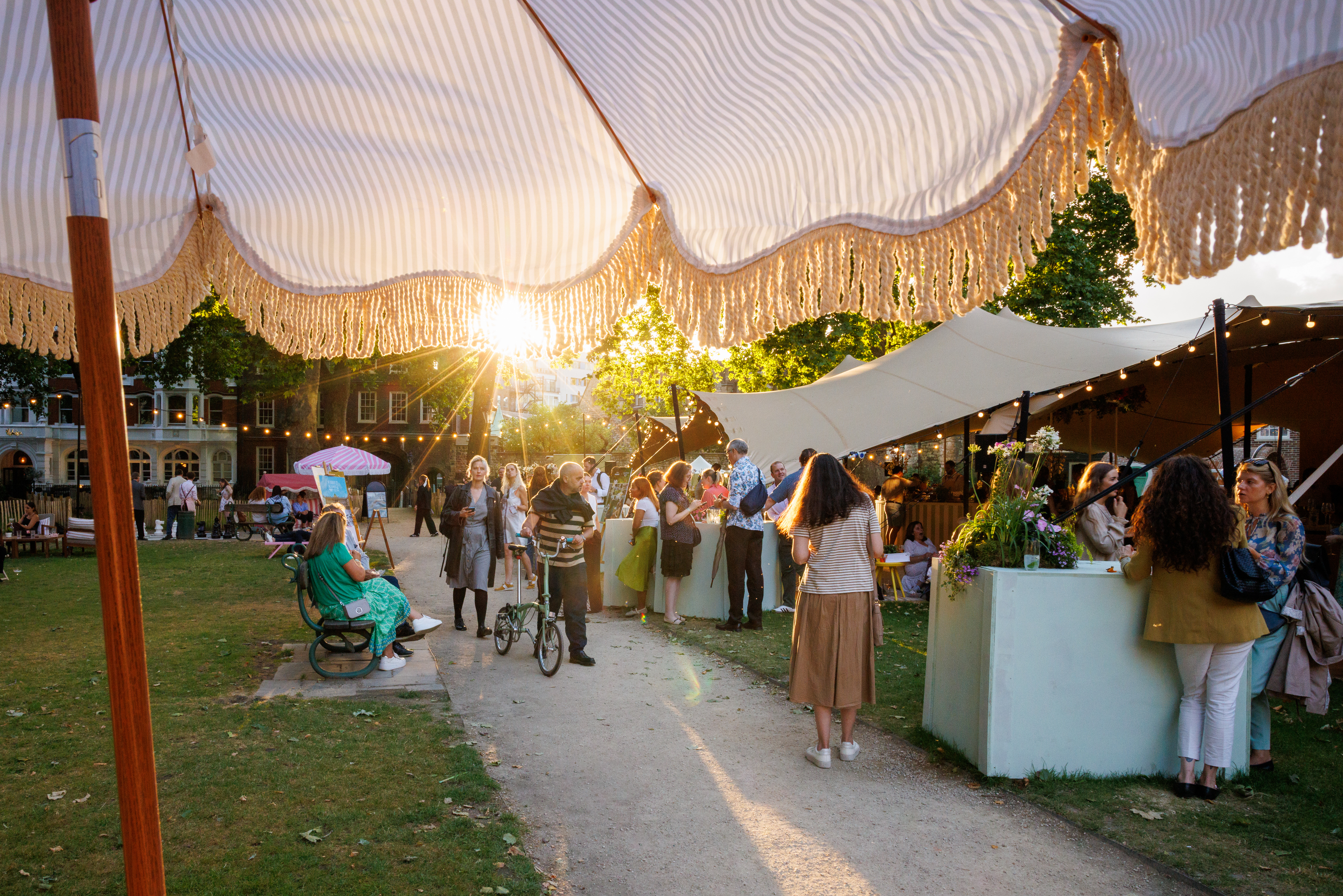 Exclusive Hire outdoor summer party in Charterhouse Square, sunny atmosphere, networking event.