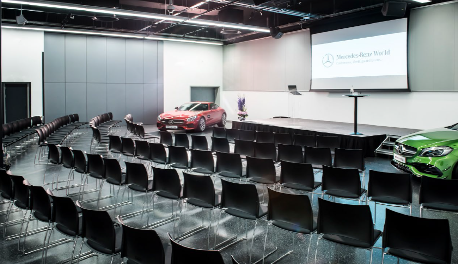 Brooklands Hall at Mercedes-Benz World, modern event space for corporate presentations.