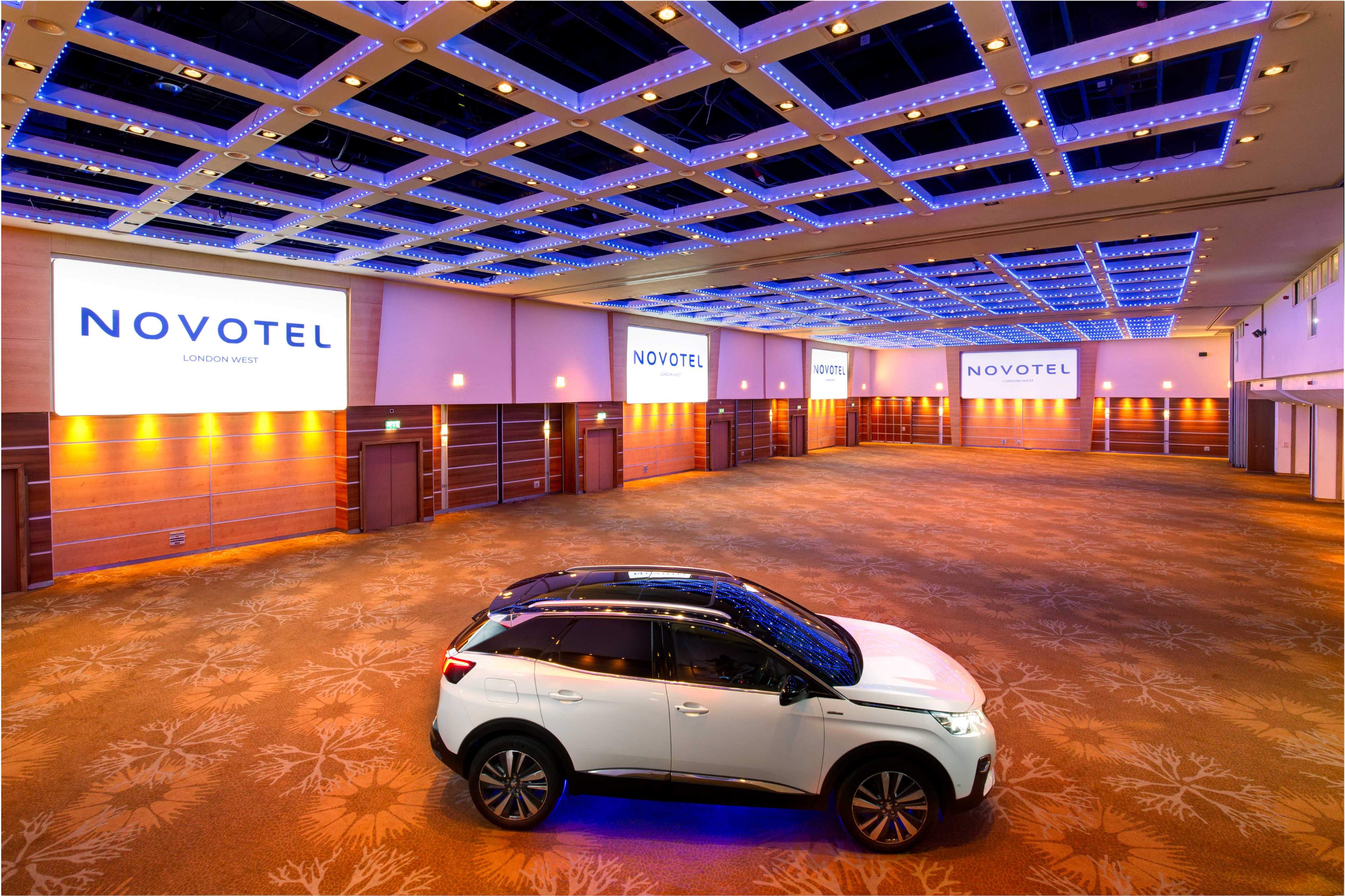 Spacious Novotel London West event venue with ambient lighting for product launches.