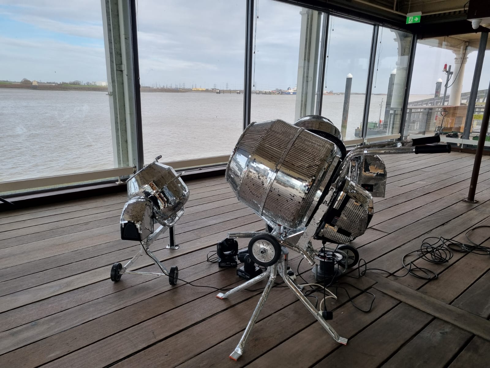 Avant-garde mirror concrete mixer art installation at Gravesend Town Pier event venue.