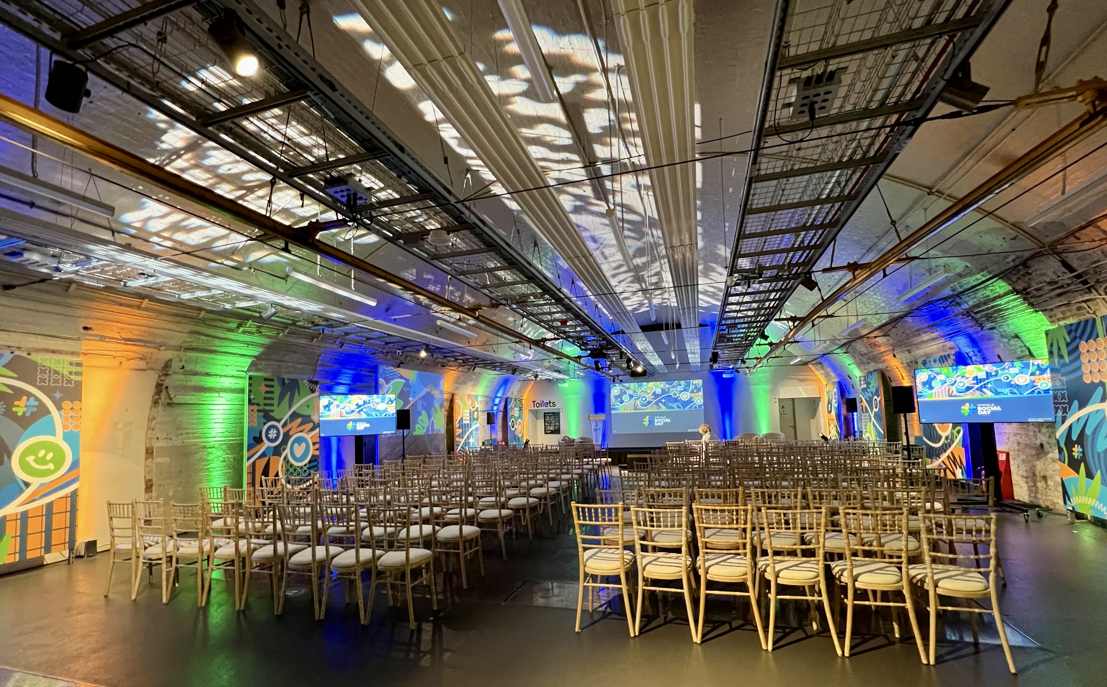 Conference space at The Postal Museum with elegant chairs and vibrant lighting.