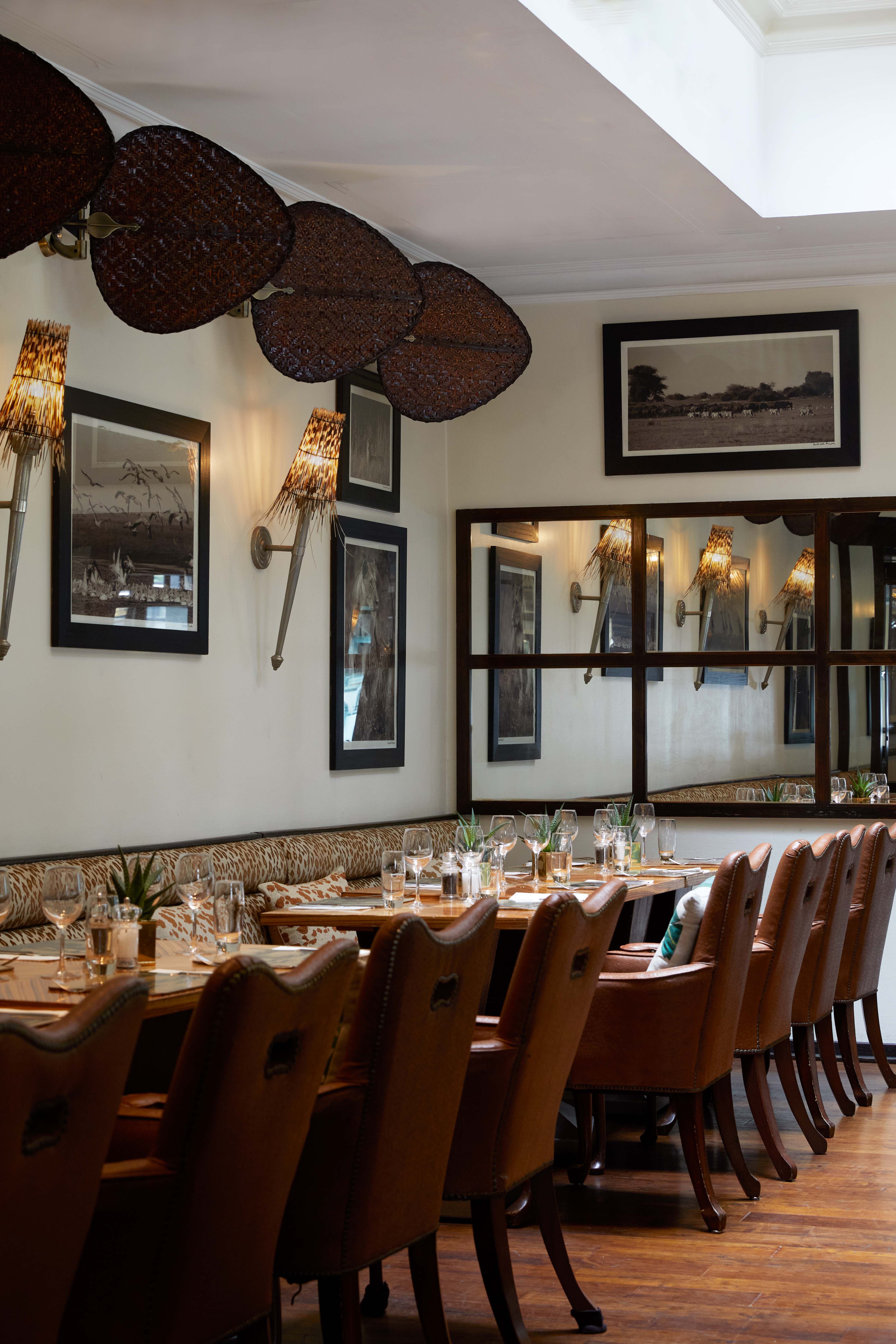 Stylish Upper Bar dining space with warm lighting for intimate gatherings and corporate dinners.