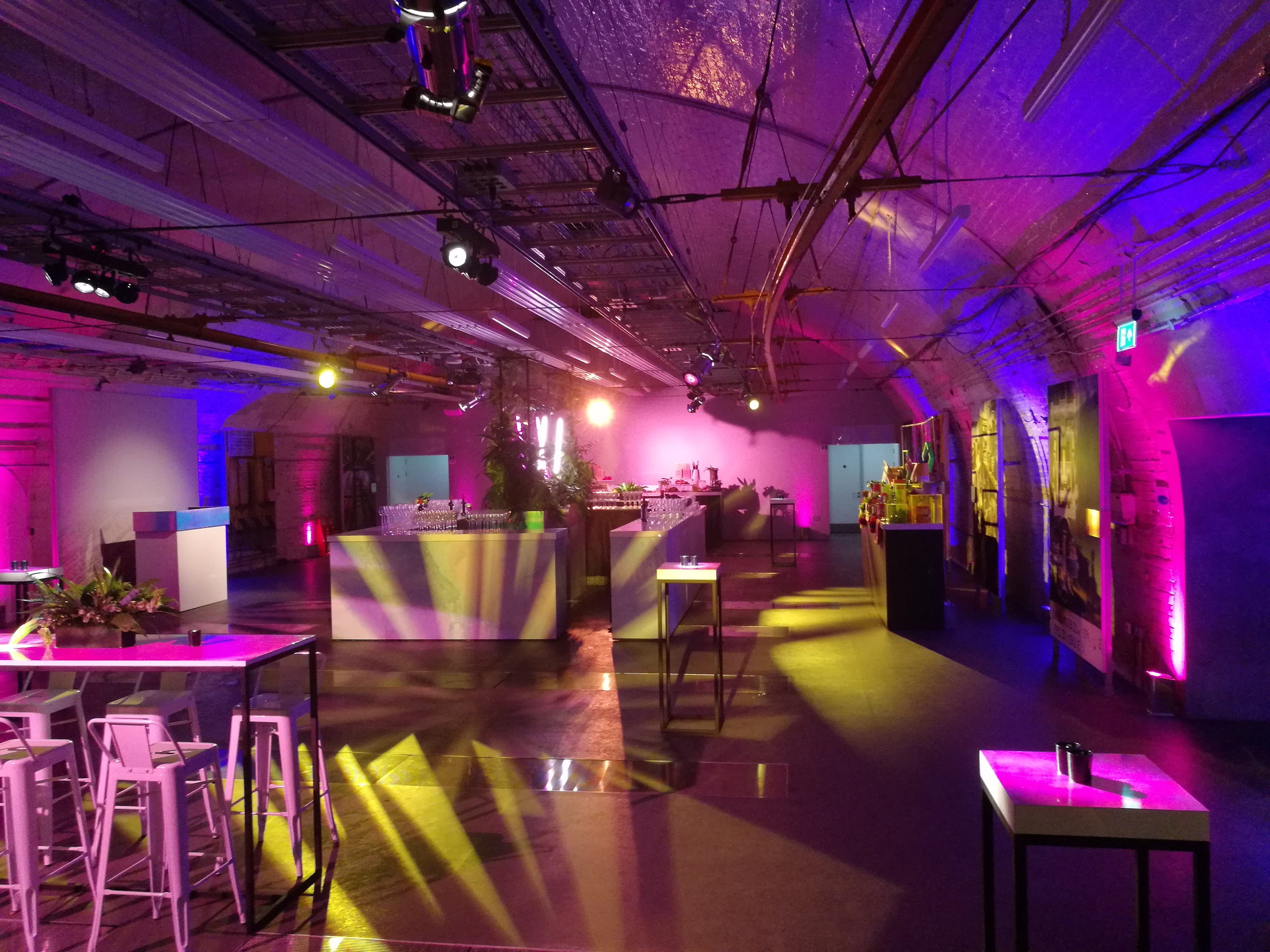 Party at Mail Rail: modern event space with dynamic lighting for corporate gatherings.